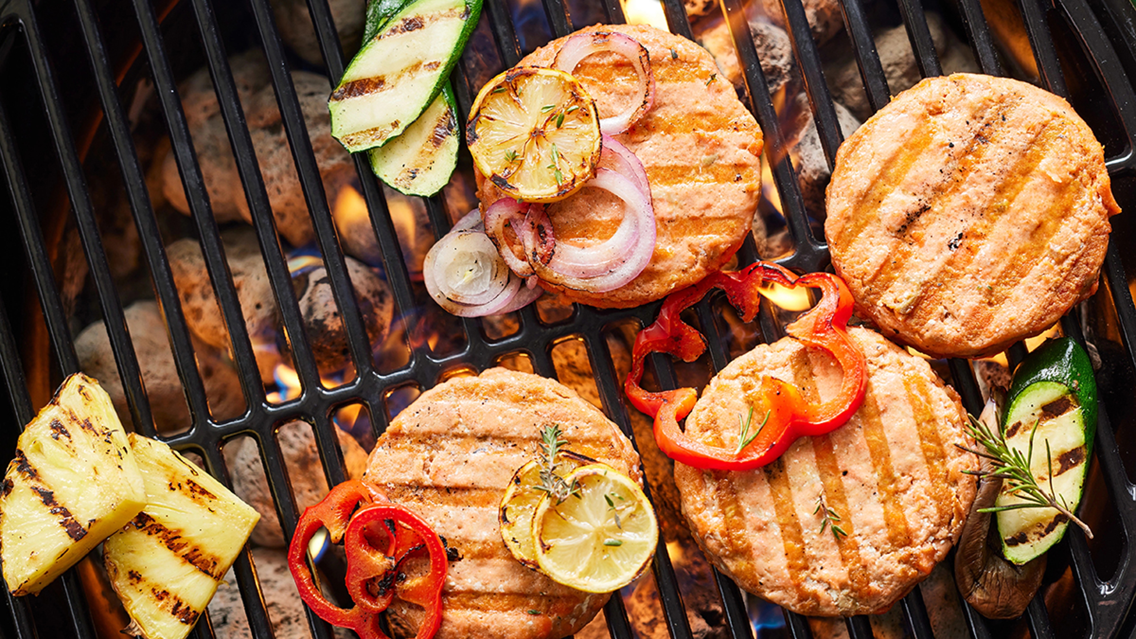 Salmon burgers on a grill