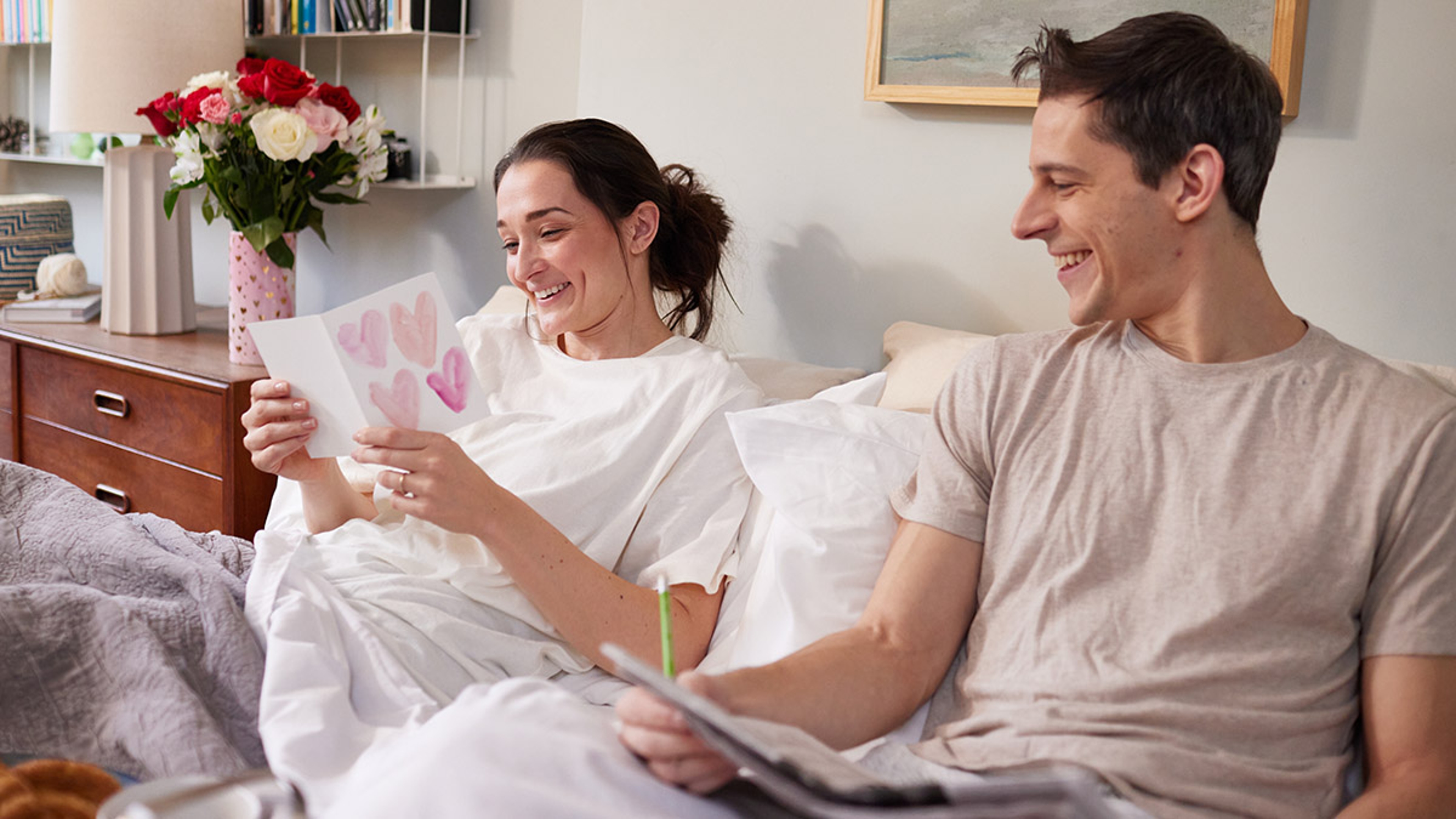 valentines messages woman laughing at card