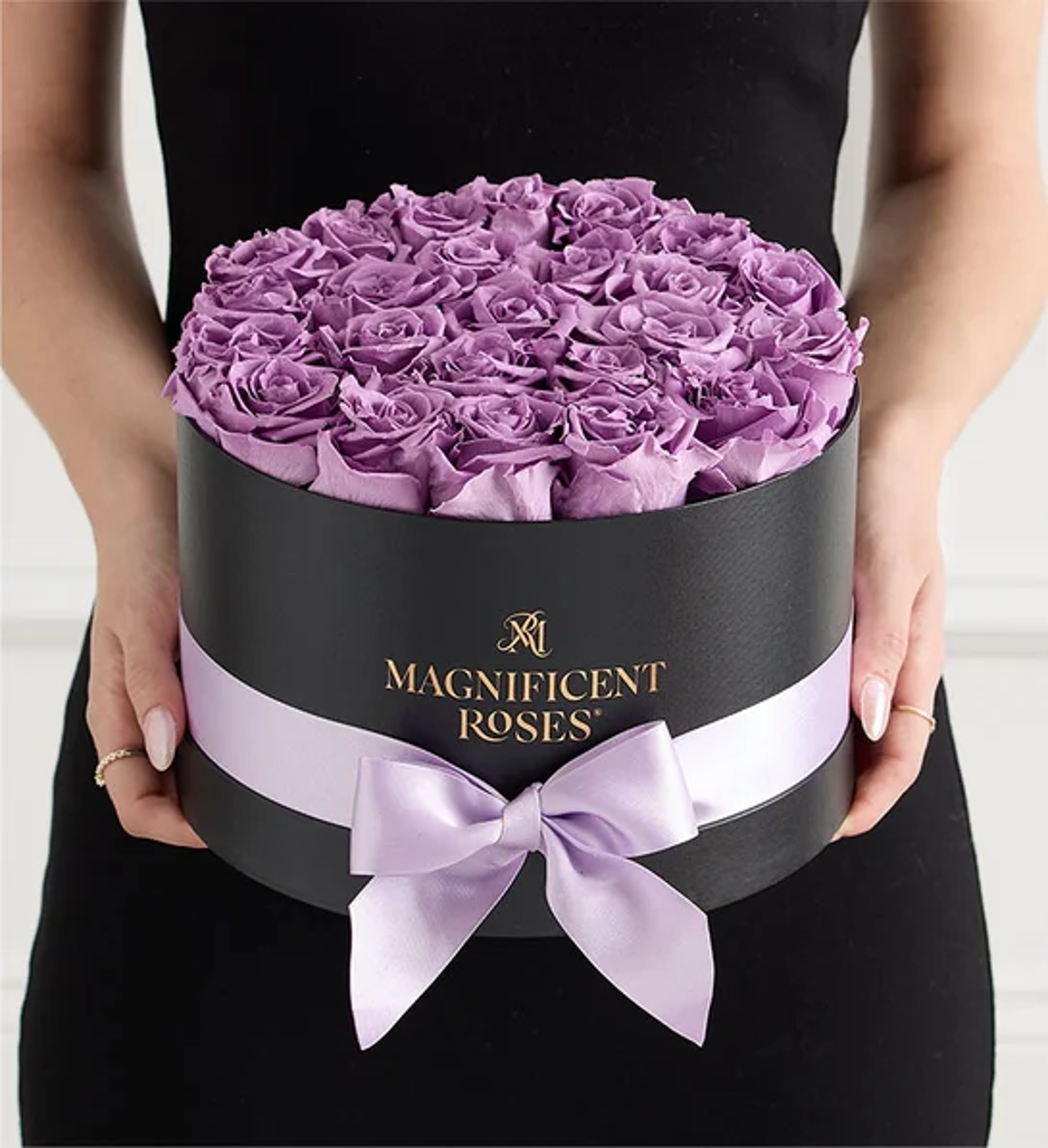 what are preserved roses woman holding purple roses