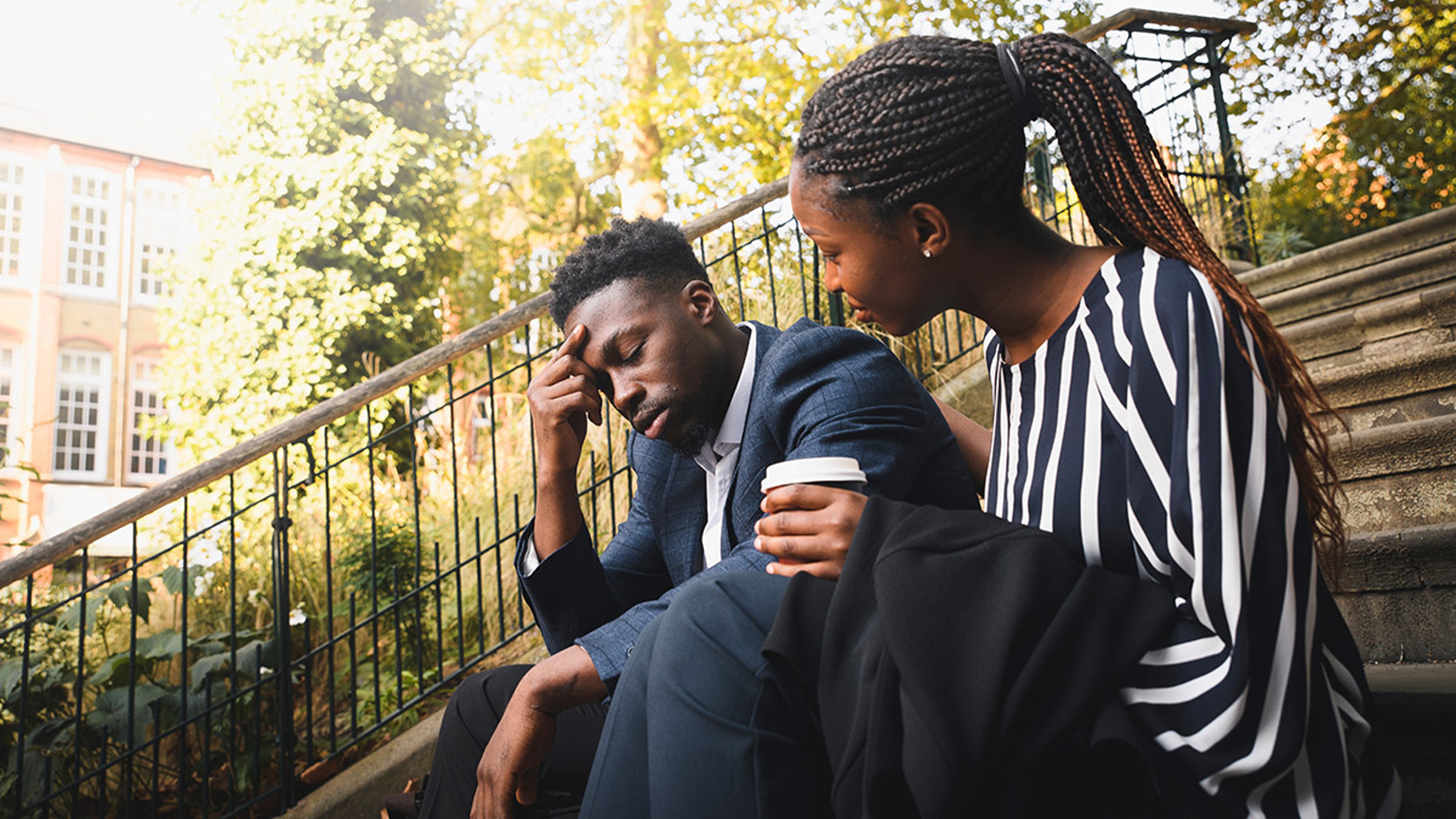Article Cards Featured Image how to support a grieving co worker with female colleague consoling male co worker