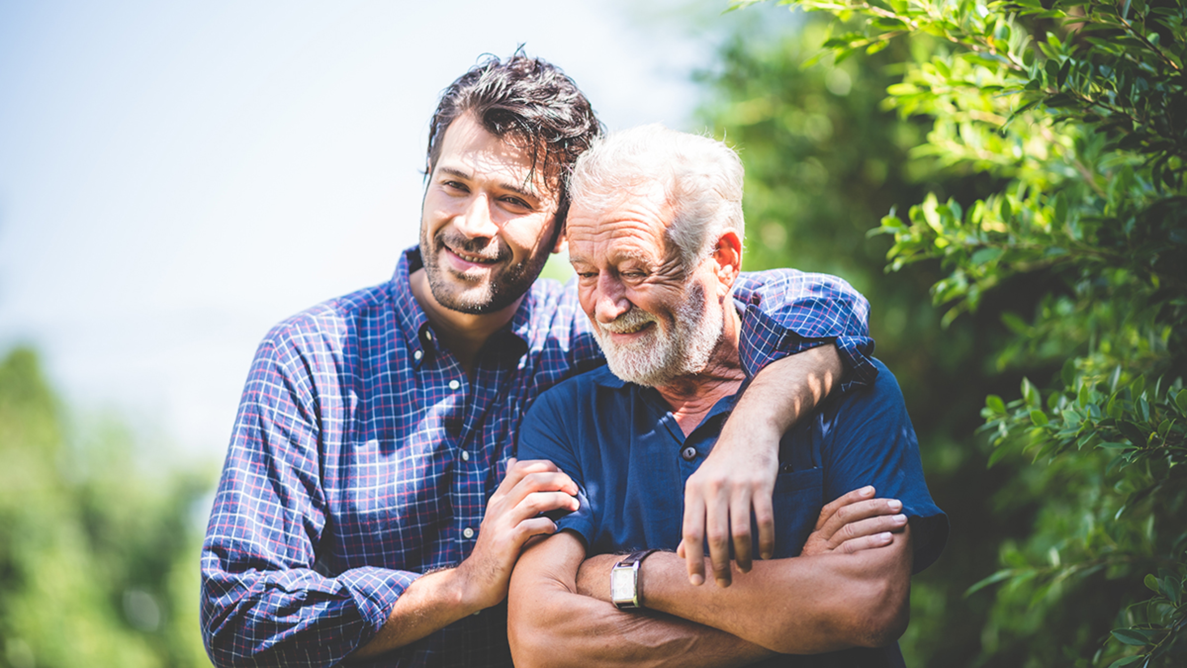 Article Cards Featured Image happy hipster adult son and senior father hugging at home, concept of stay at home with family