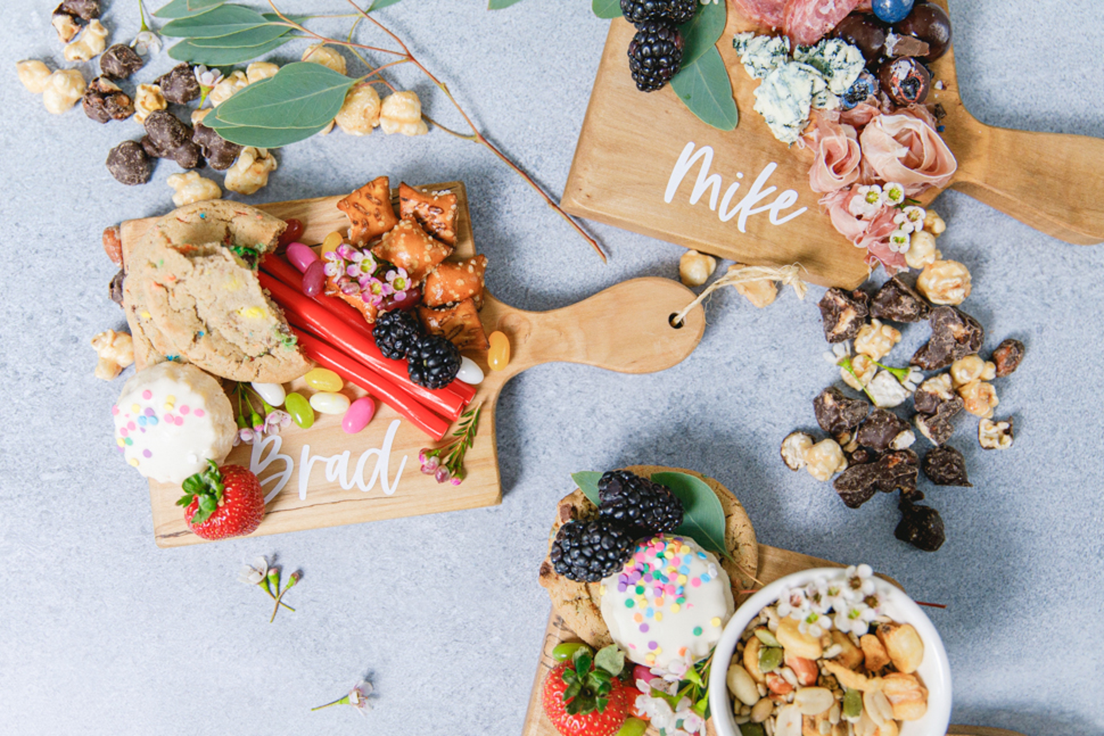 Host a movie night with personalized snack boards.