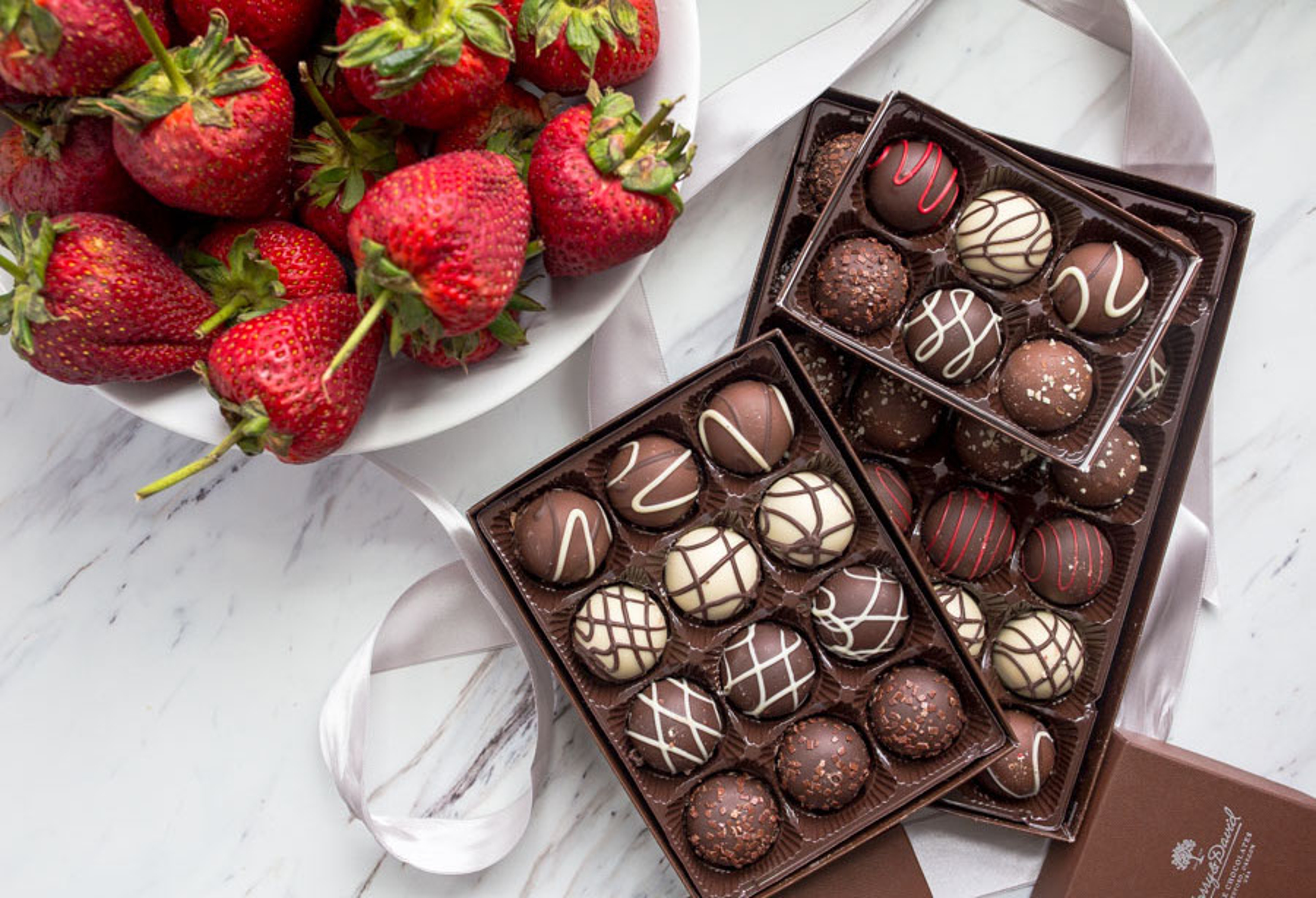 How to make chocolate covered strawberries with truffles and strawberries.