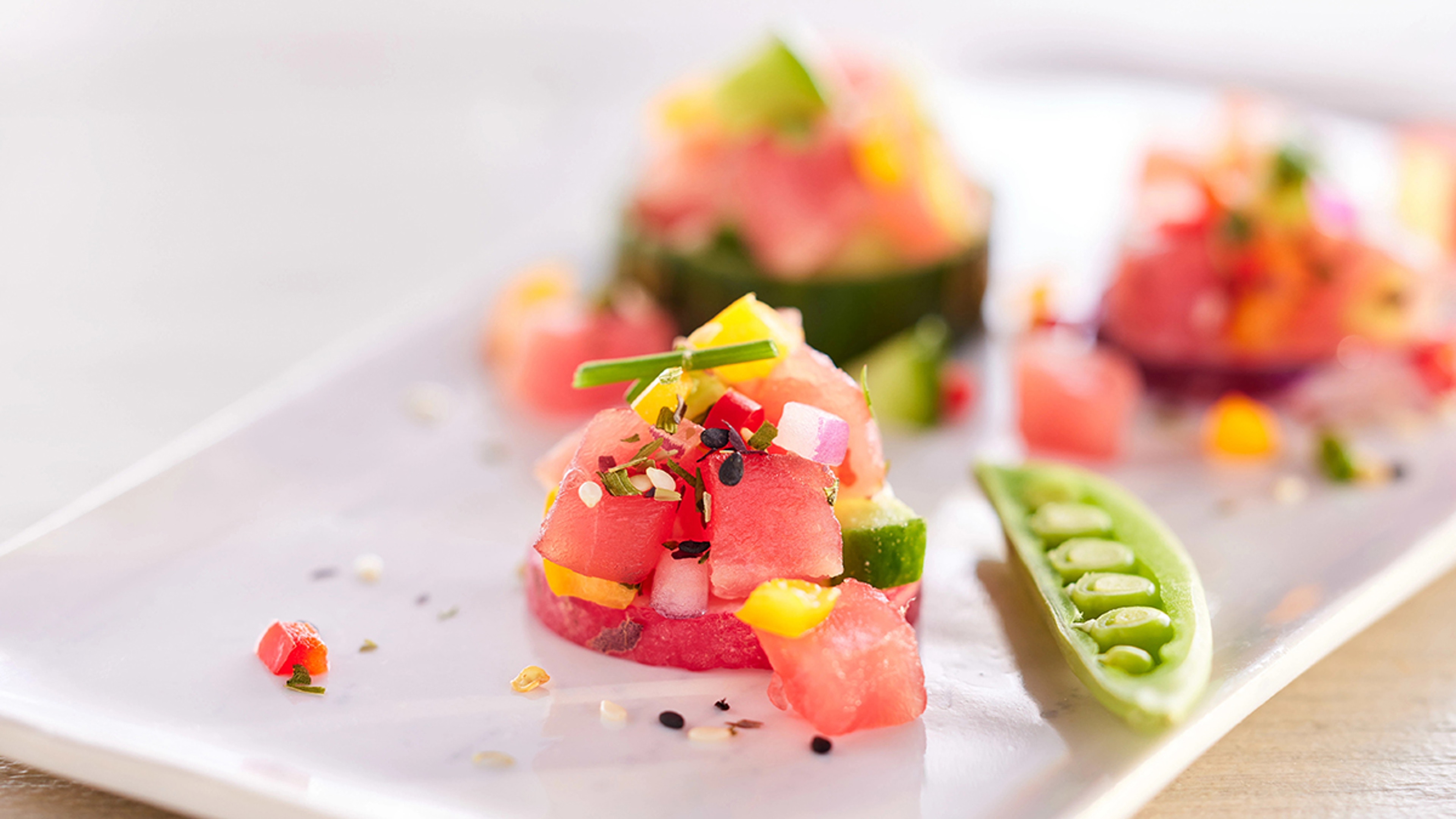 Yellowfin tuna ceviche on a plate.