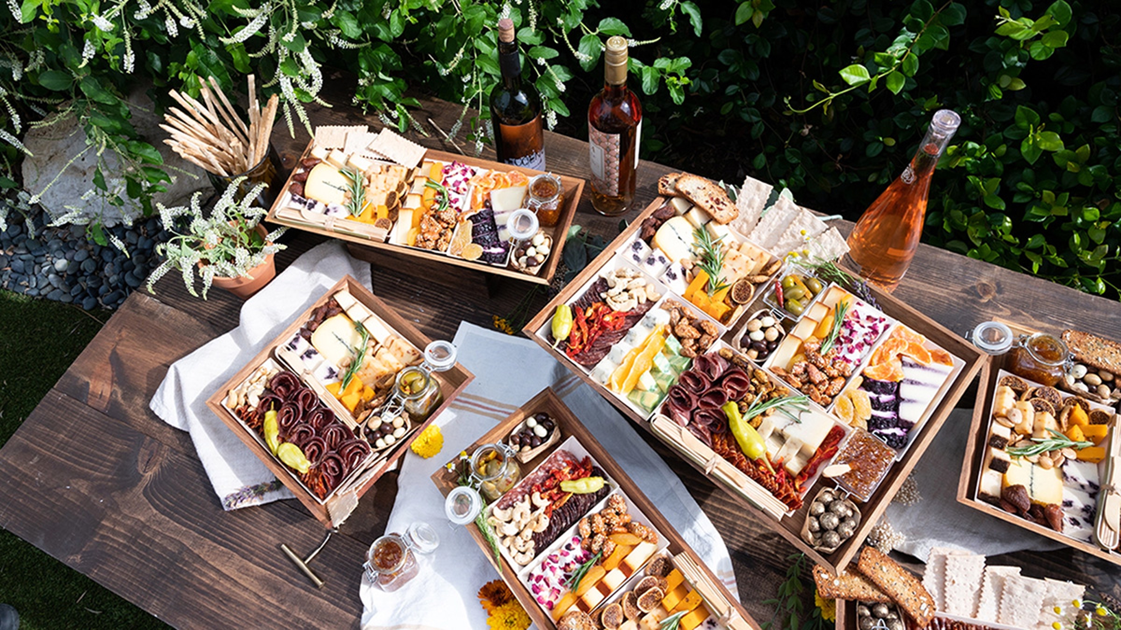 Spread of charcuterie and cheese with wine.