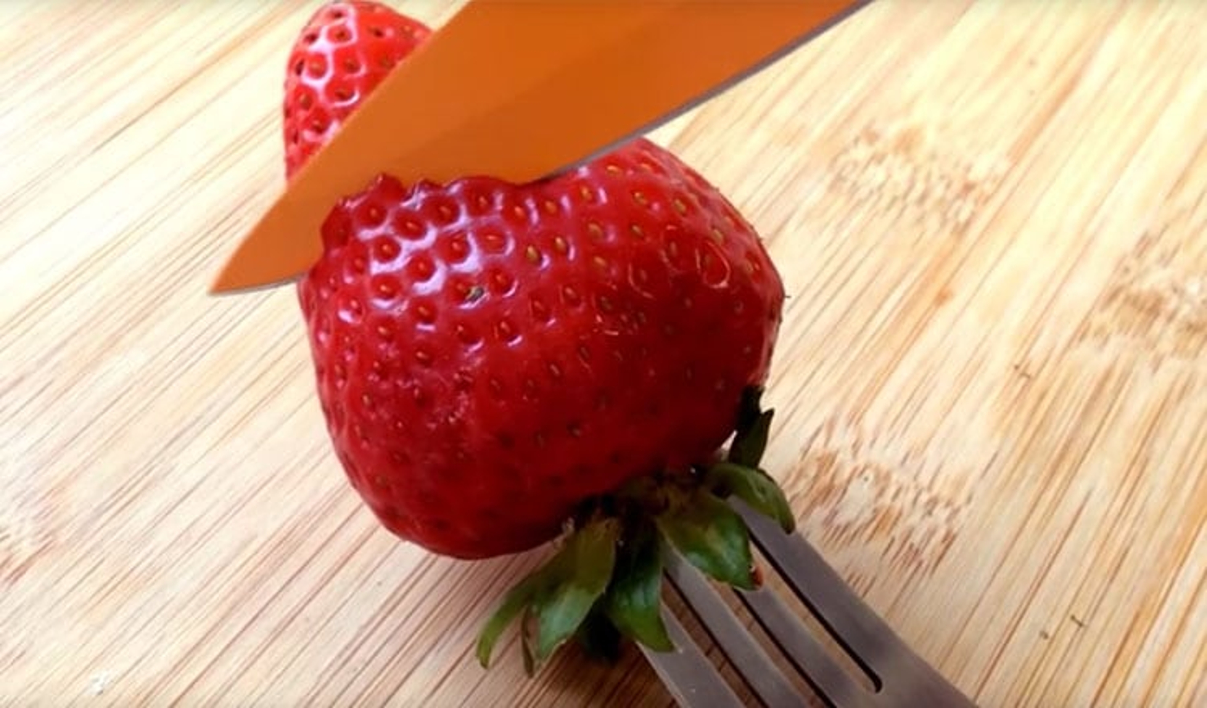 Step : Cut the first petal in the strawberry.