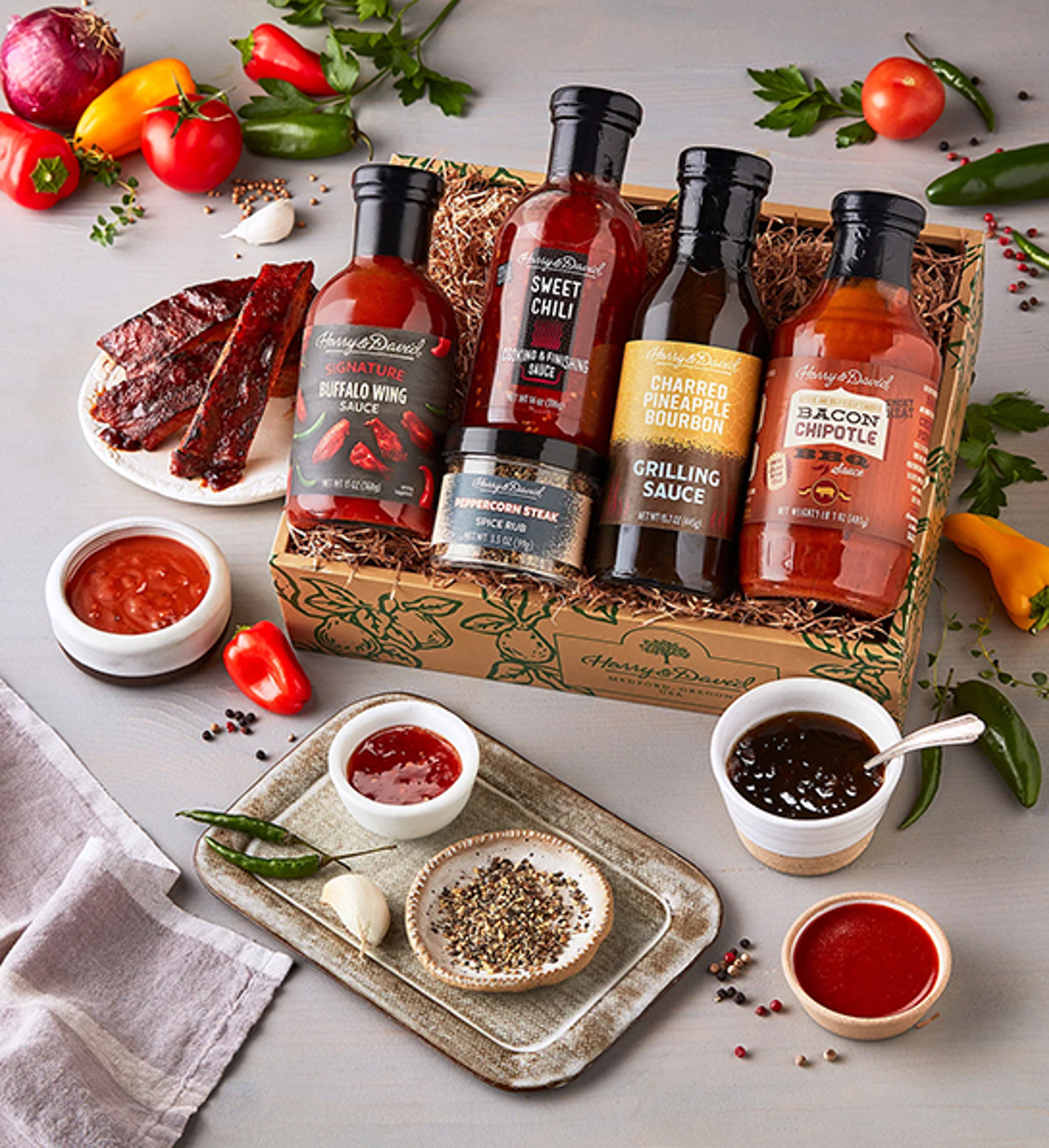 Summer gifts with a box of BBQ sauce and rubs.