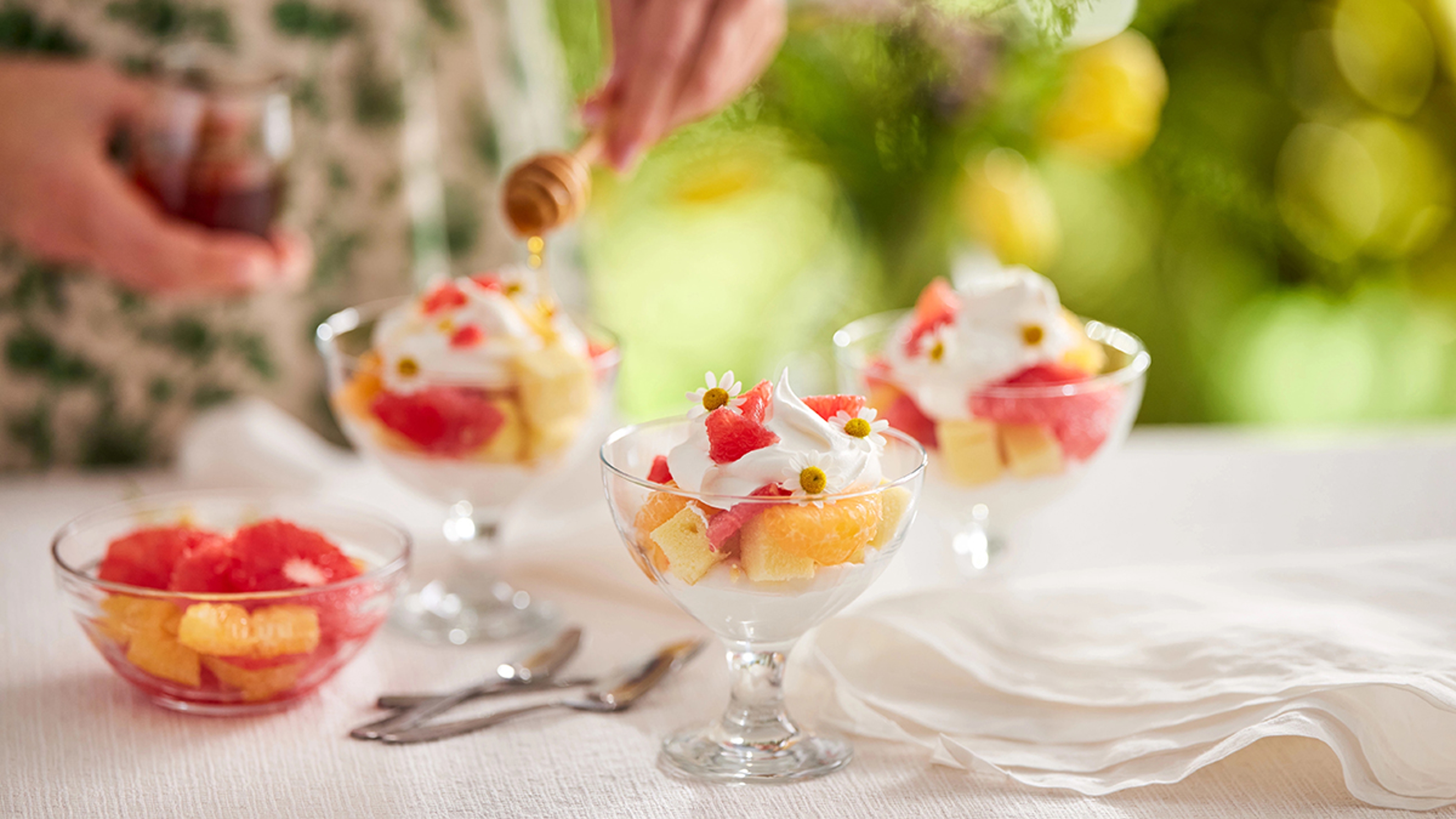 Spring birthday party ideas with someone making fruit parfaits.