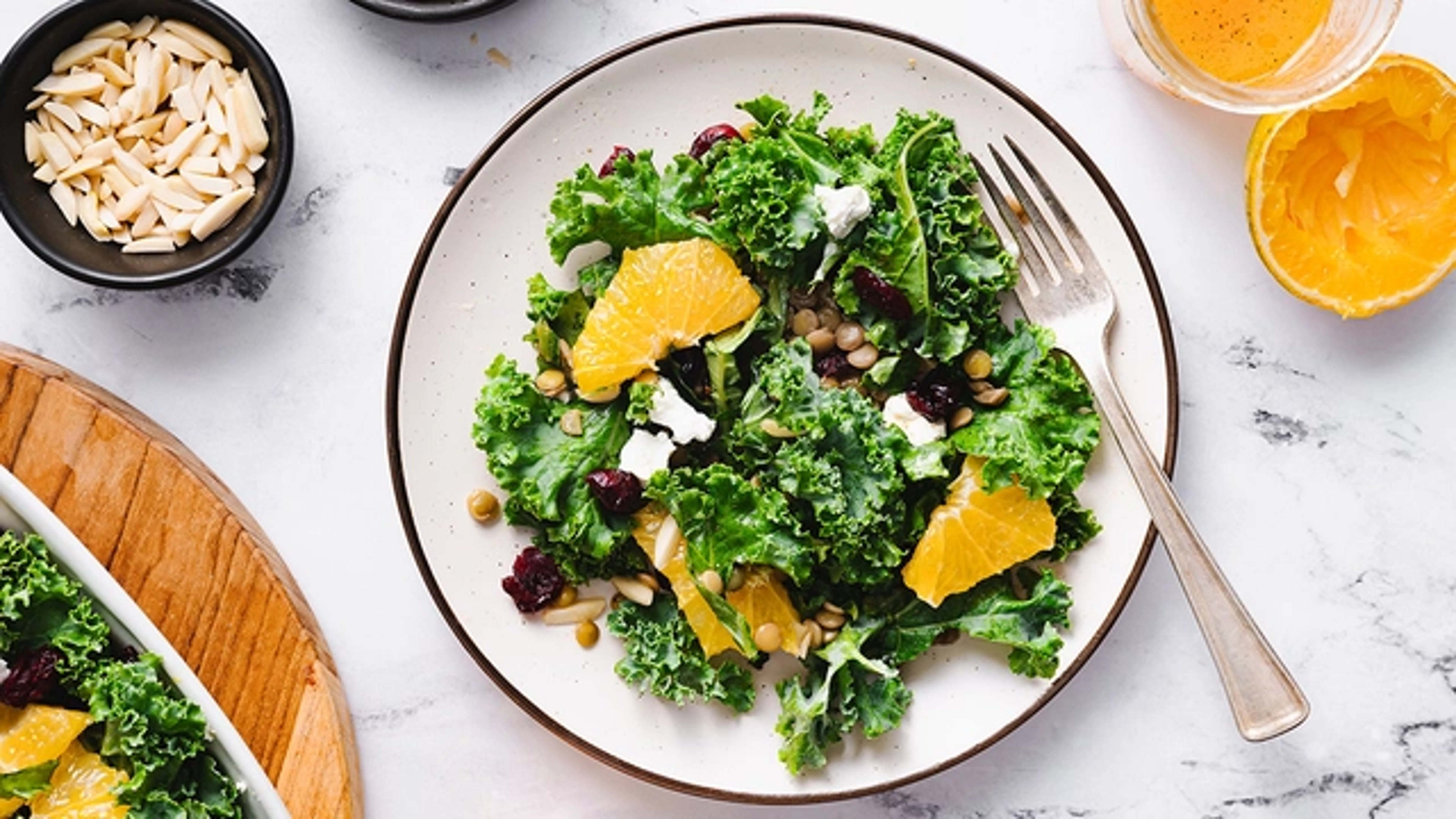 St. Patrick's Day food with a citrus kale salad on a plate.