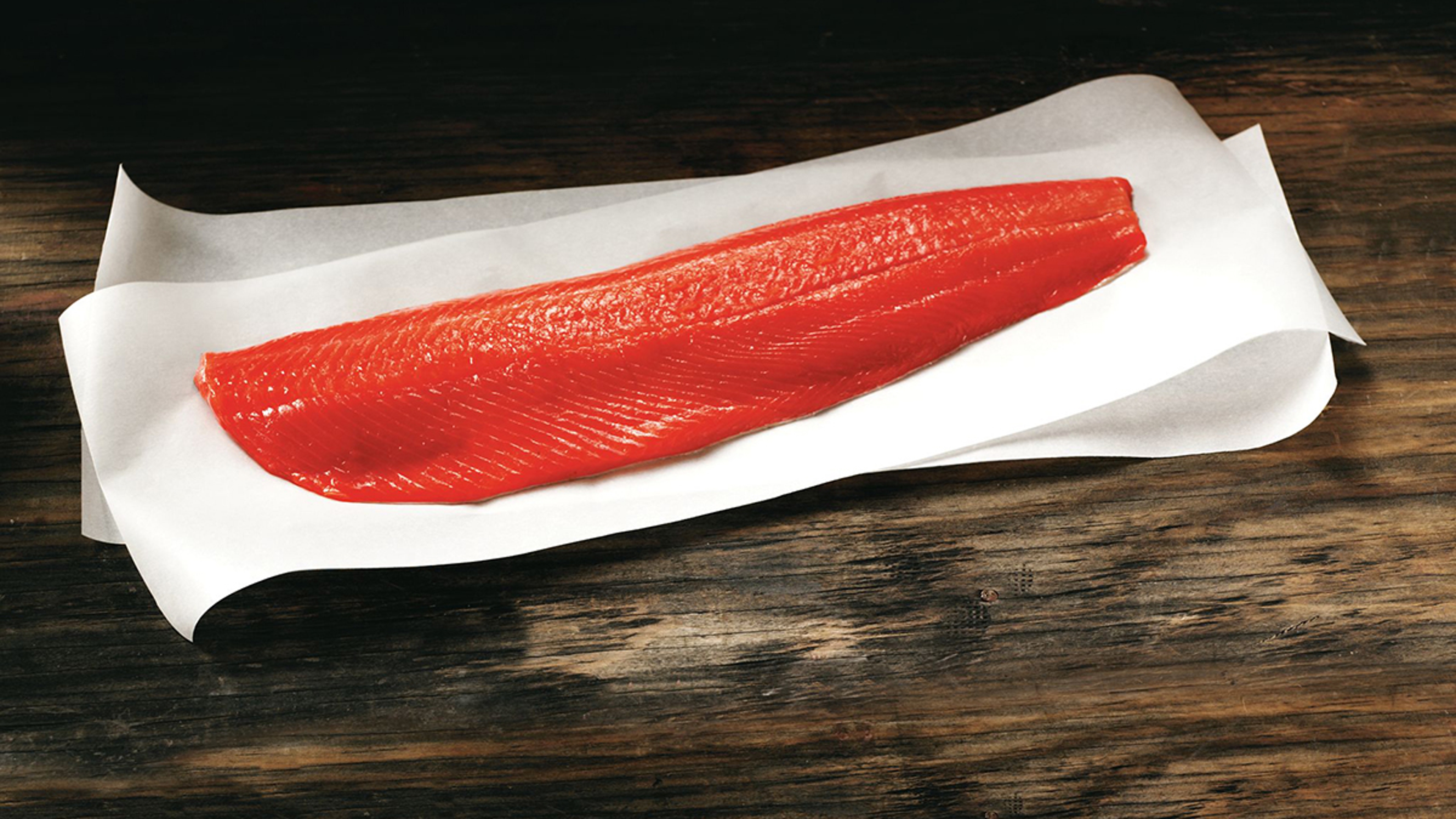 Copper River sockeye salmon filet on parchment paper.