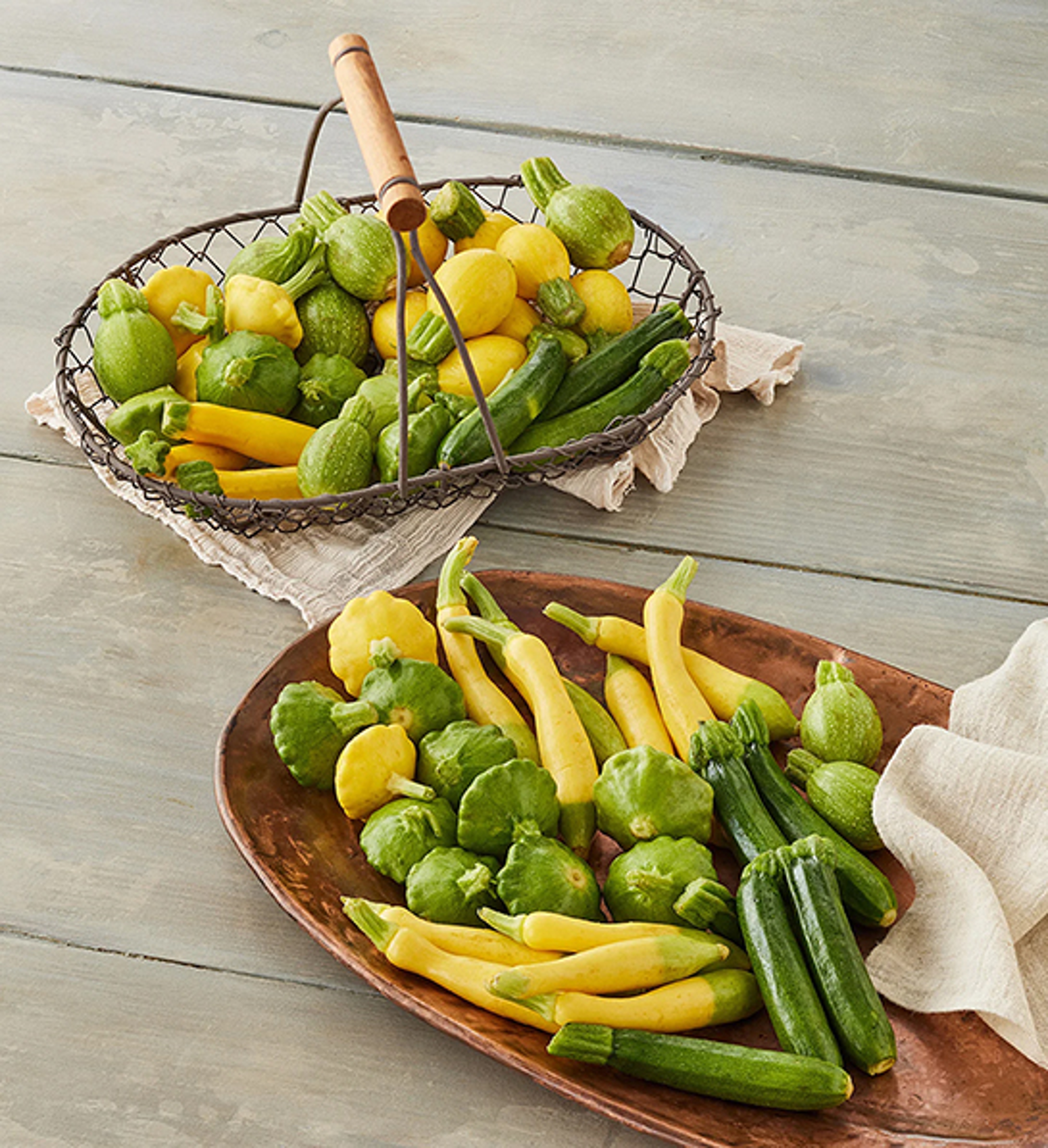 Summer gifts with two baskets of summer squash.