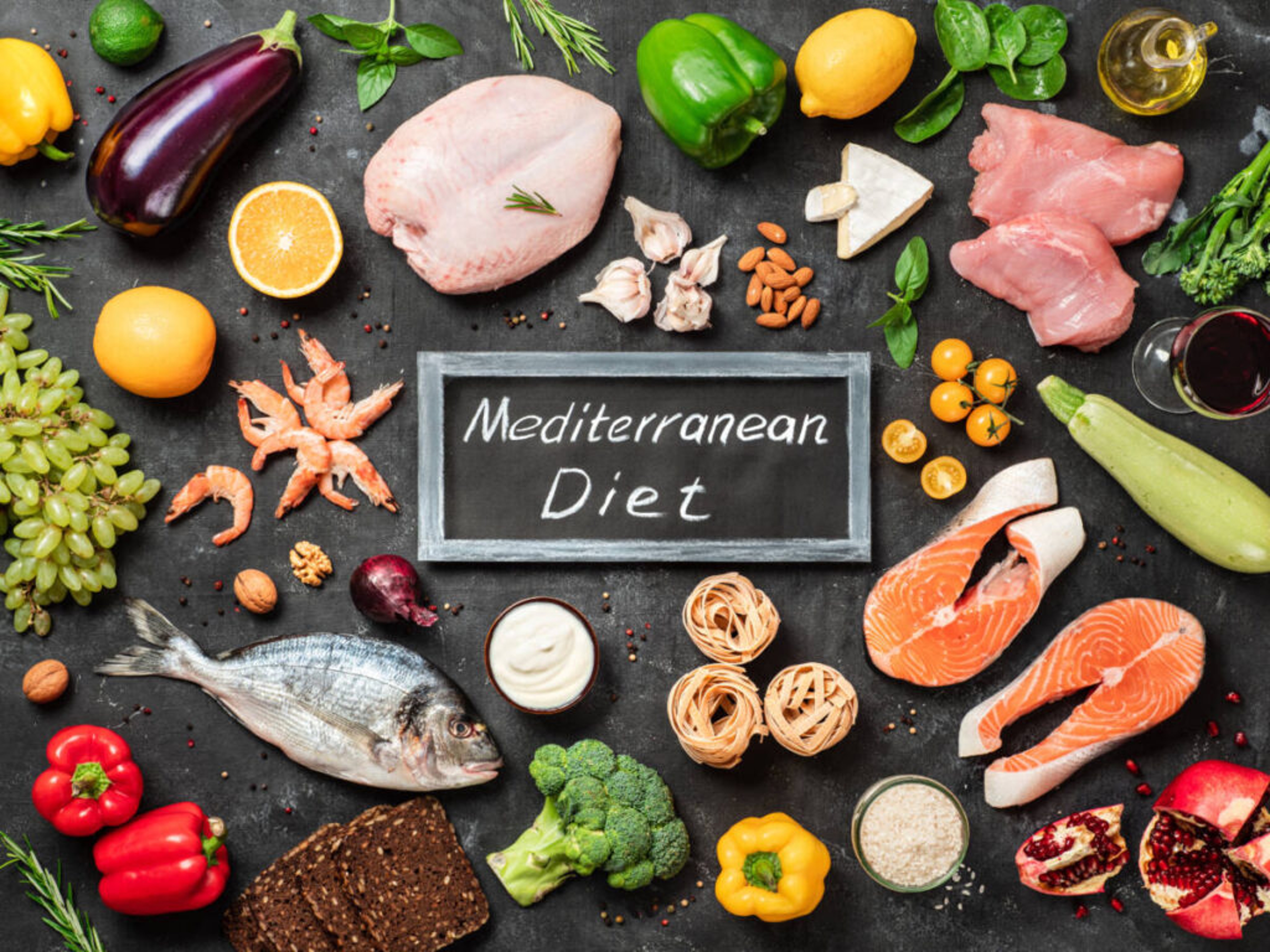 Ingredients of a Mediterranean diet on a black background.