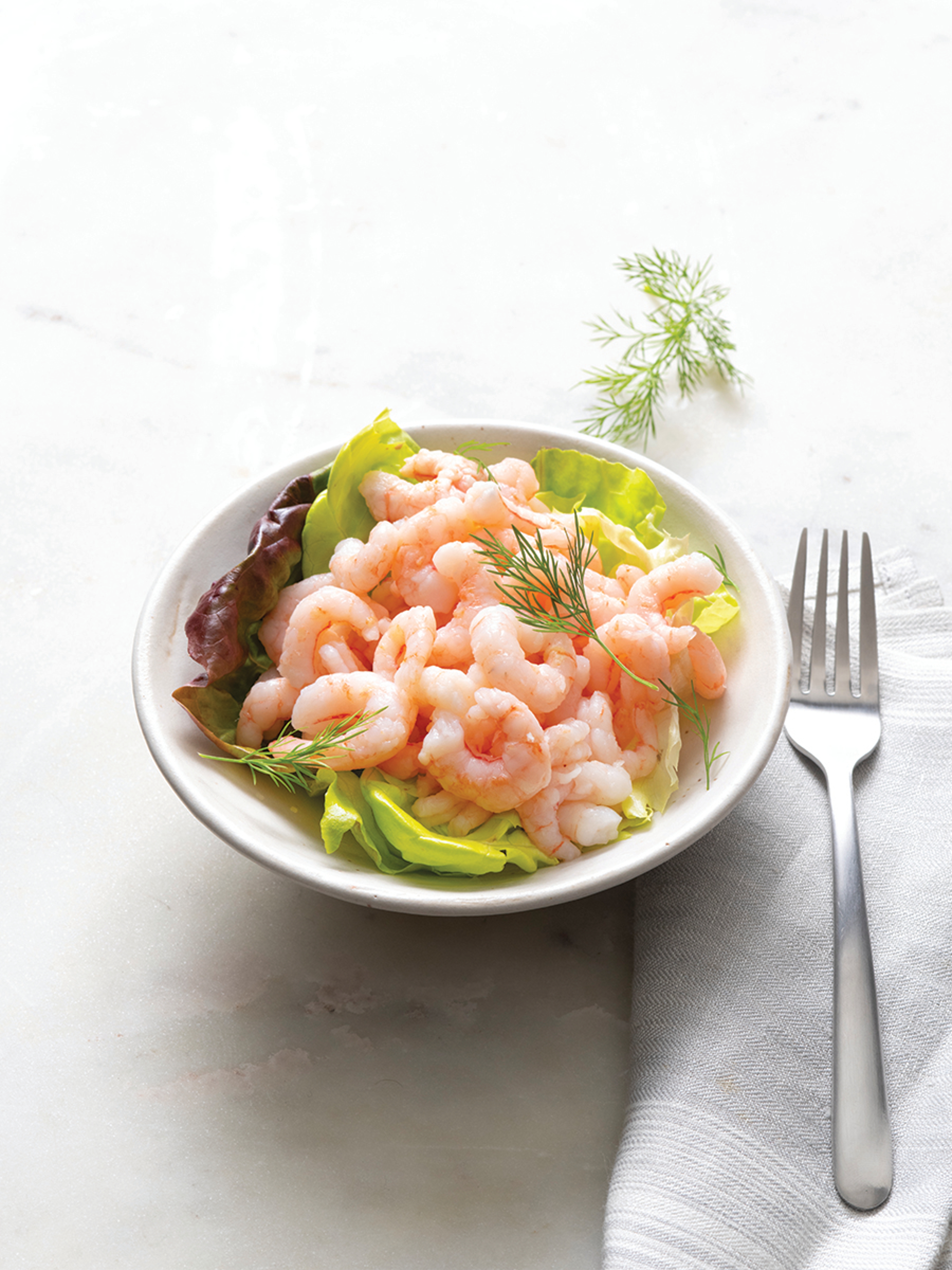 Pink shrimp in a bowl.