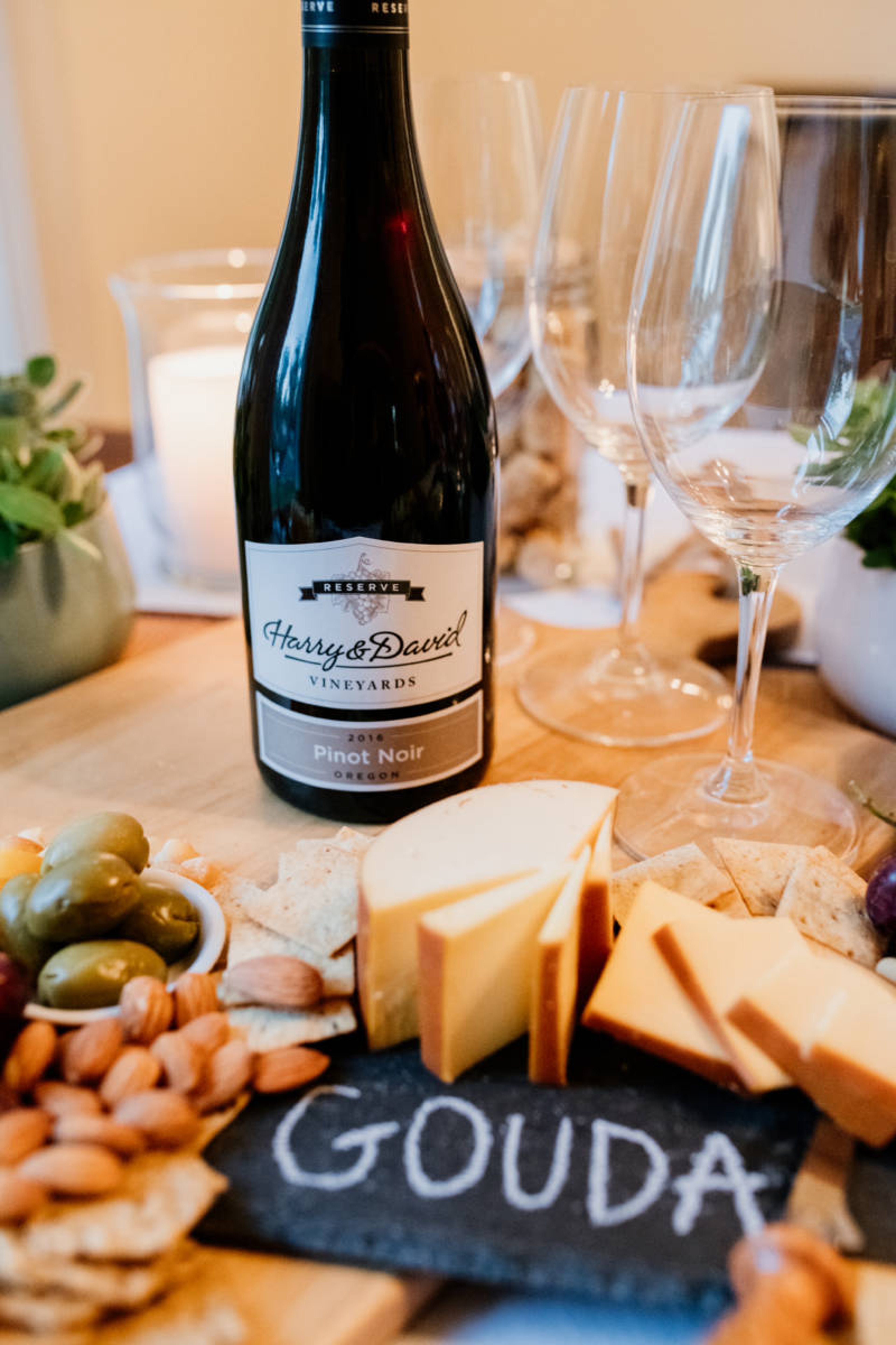 Harry & David Bottle of Pinot Noir on a wine and cheese board