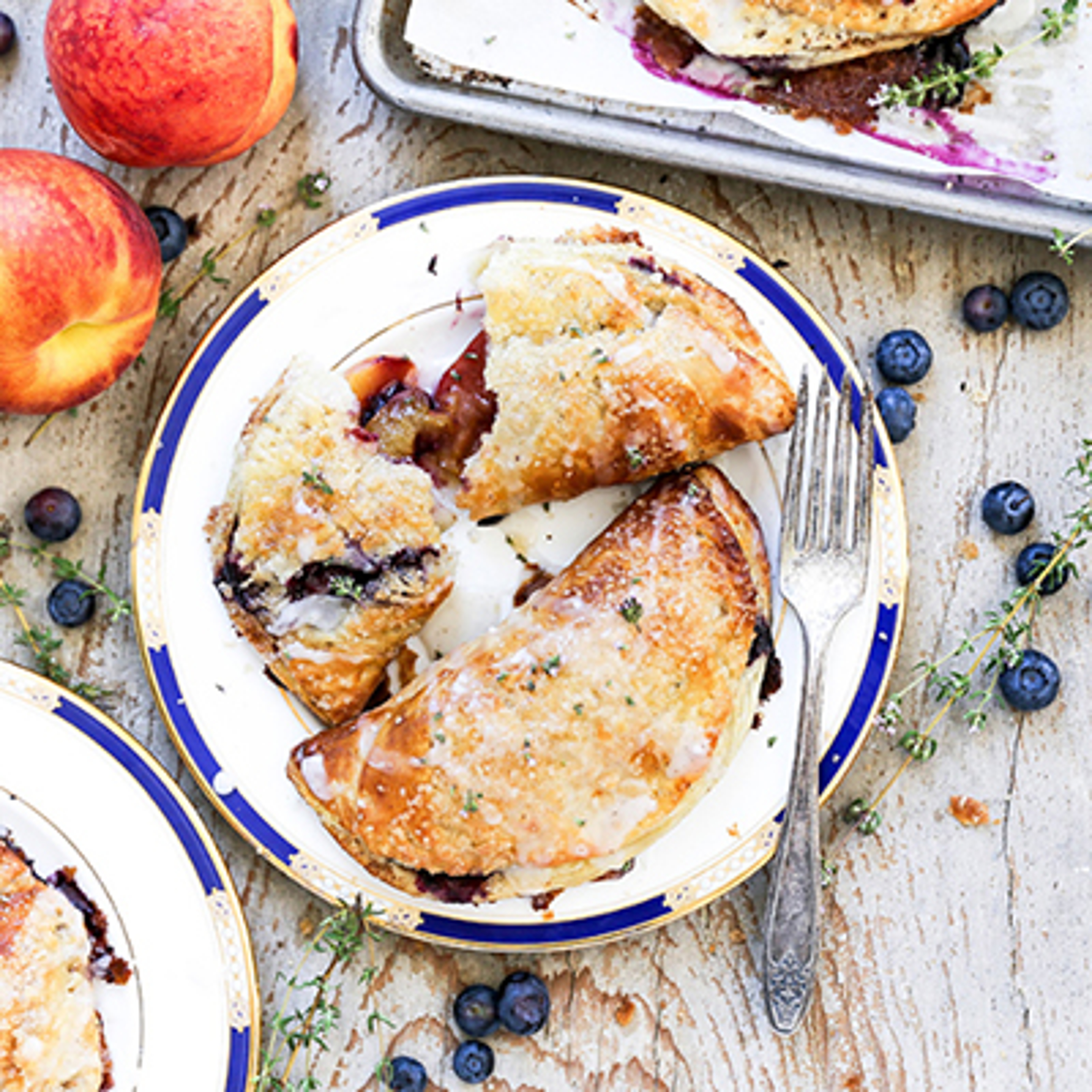 Plate of blueberry and peach hand pies.