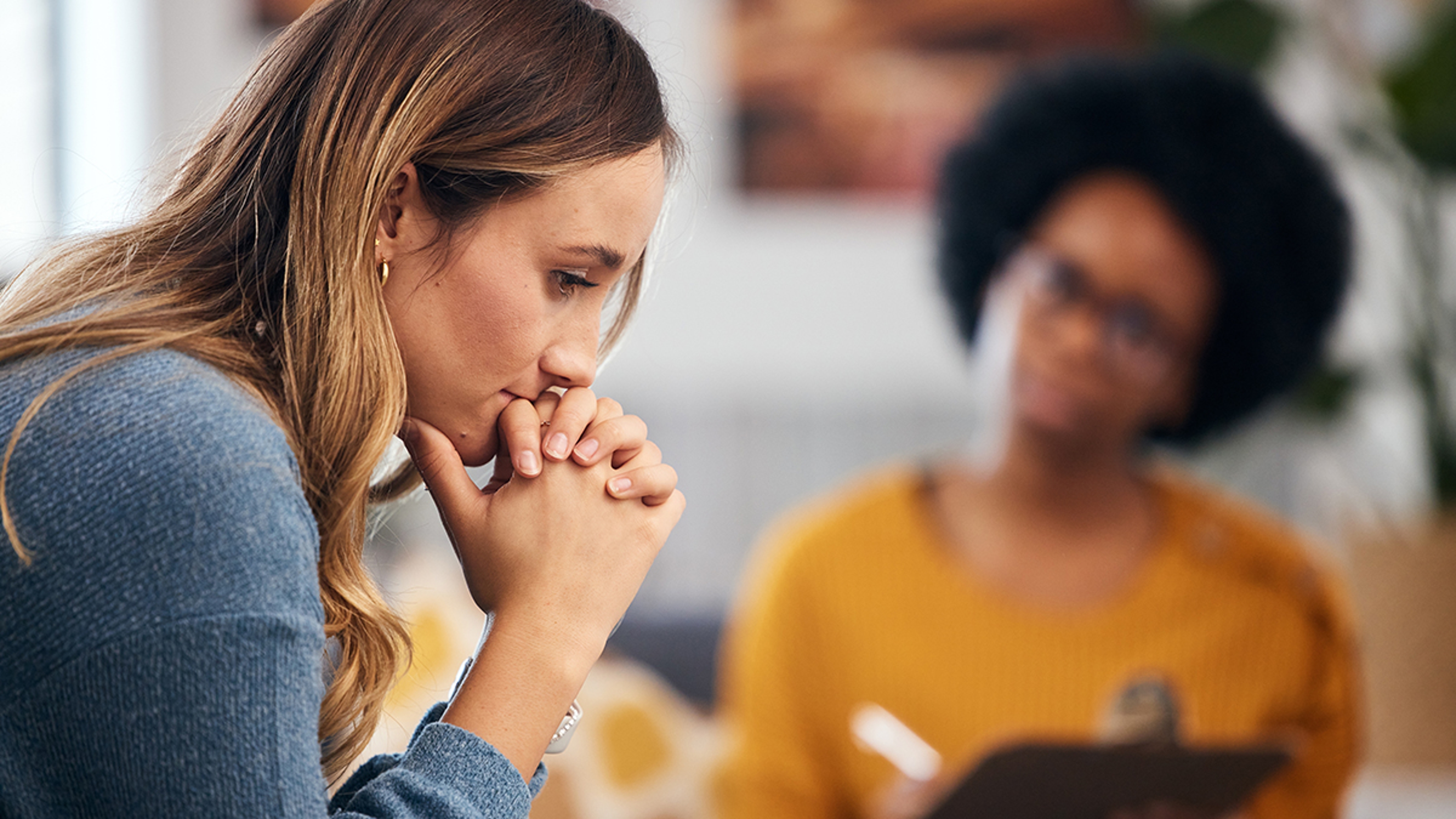 Woman thinking in a therapy session.