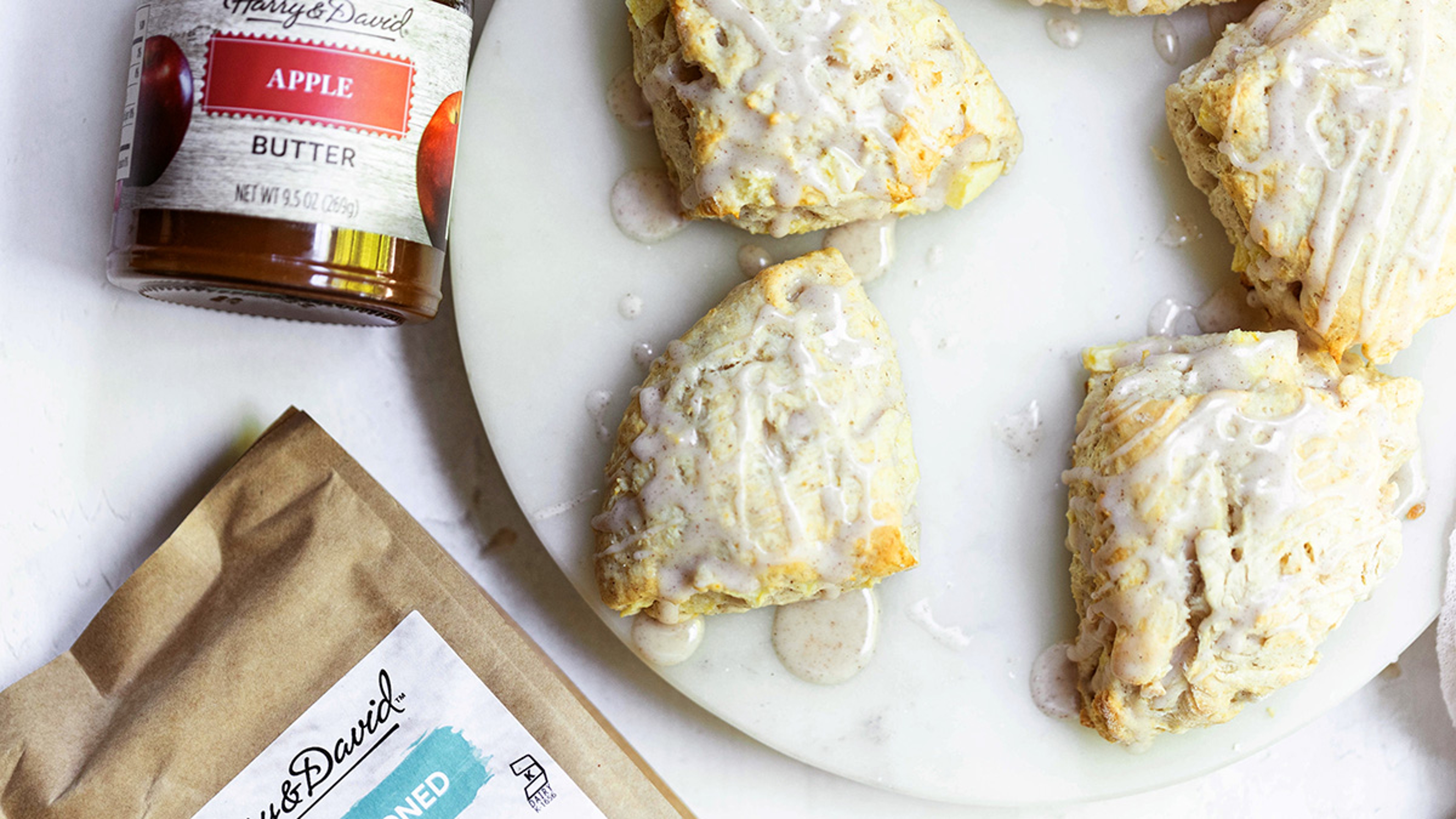 Platter of apple pie scones surrounded by ingredients.