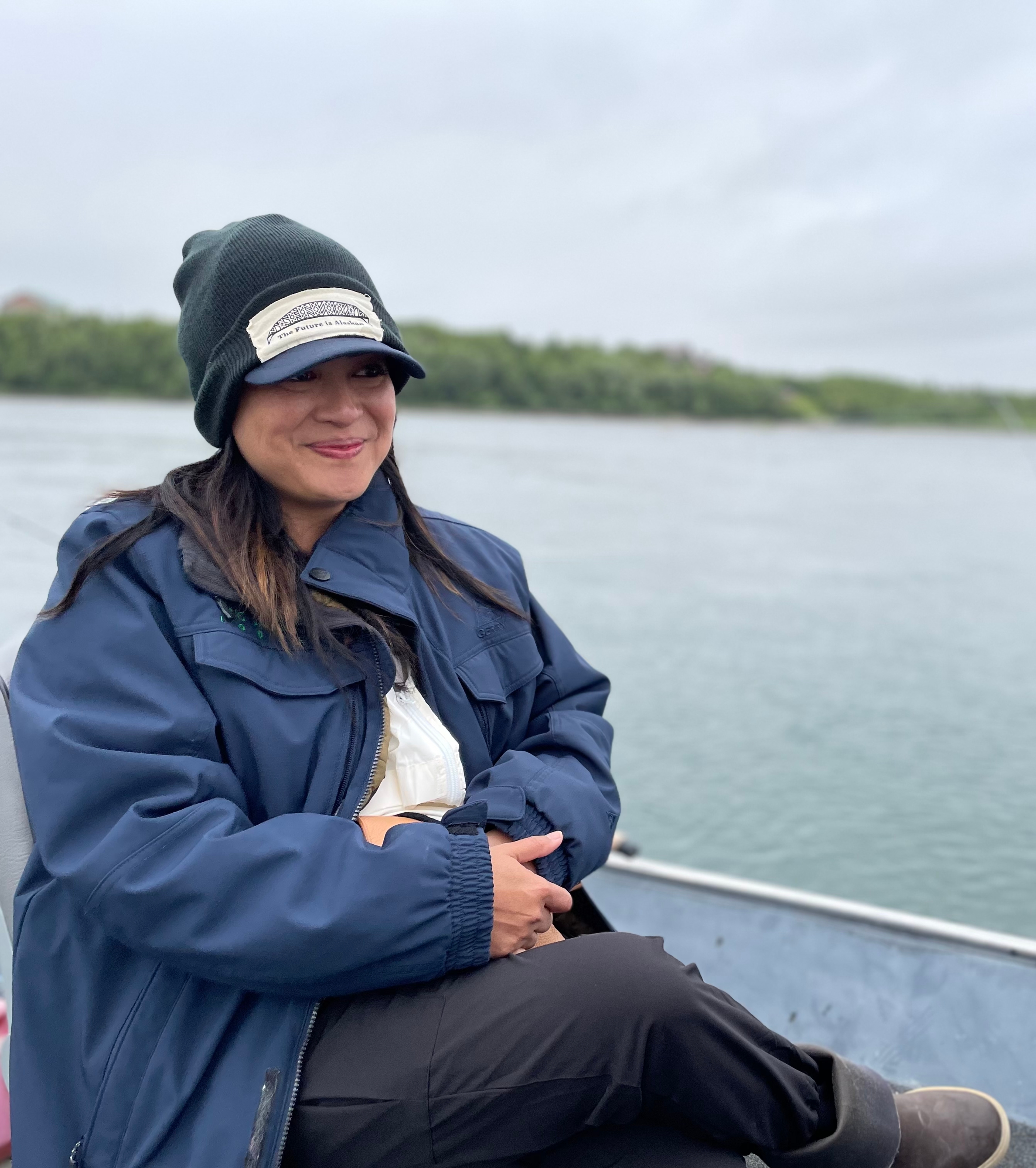 Lilani Dunn sitting on a boat in Bristol Bay.