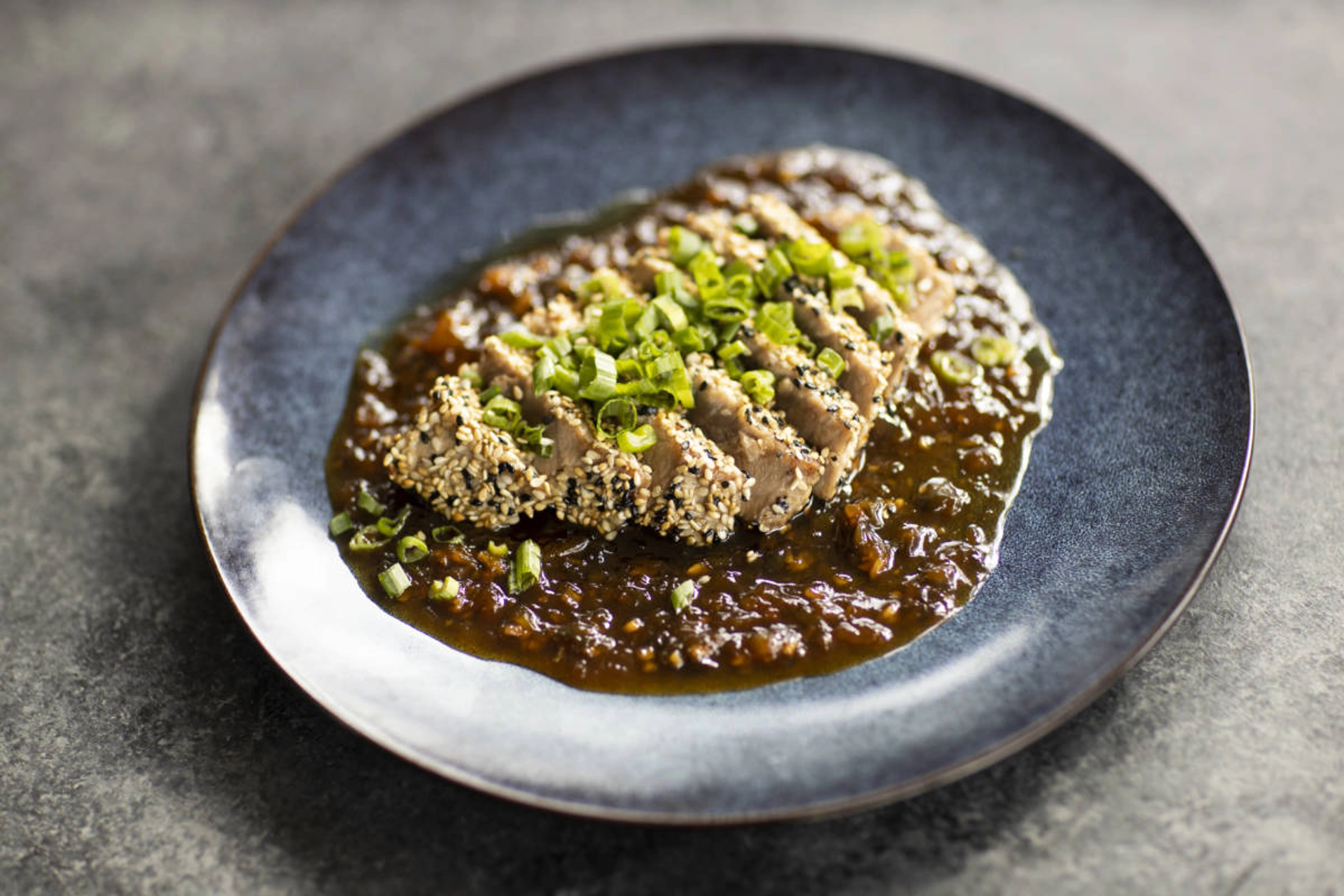 Tuna steak with honeybell sauce.