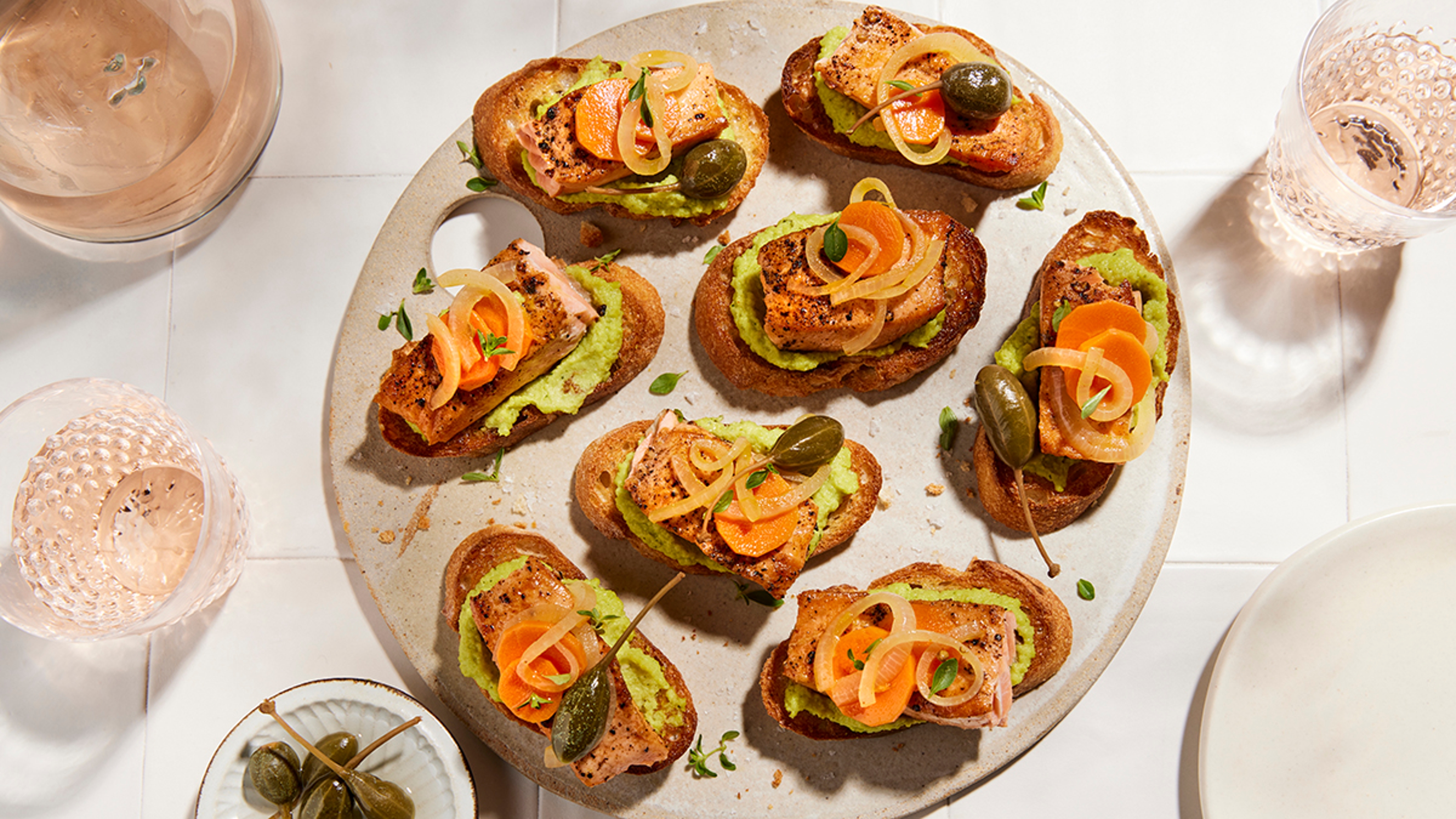 Coho salmon crostinis on a platter.