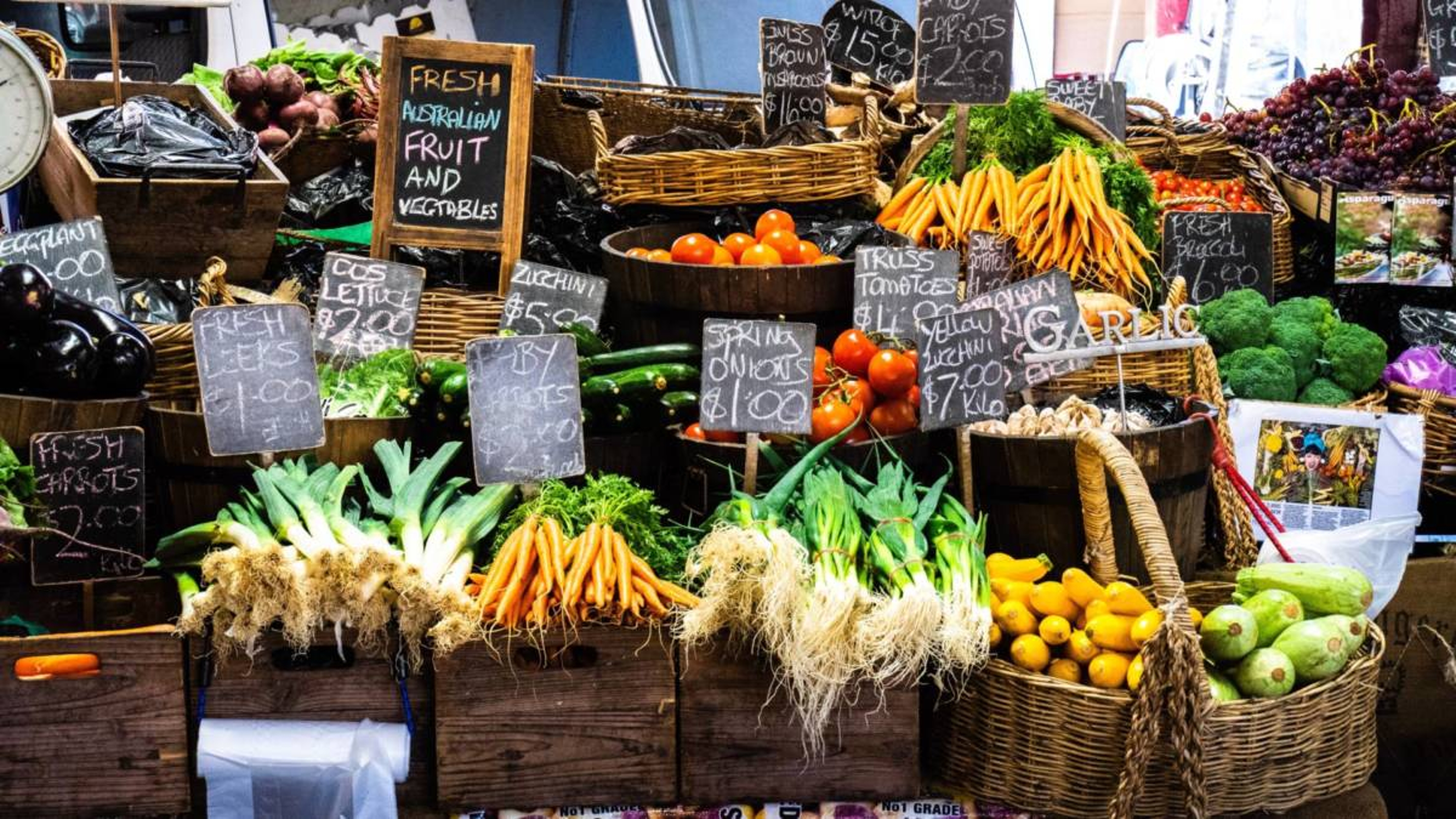 Farmers market displays with a variety of produce