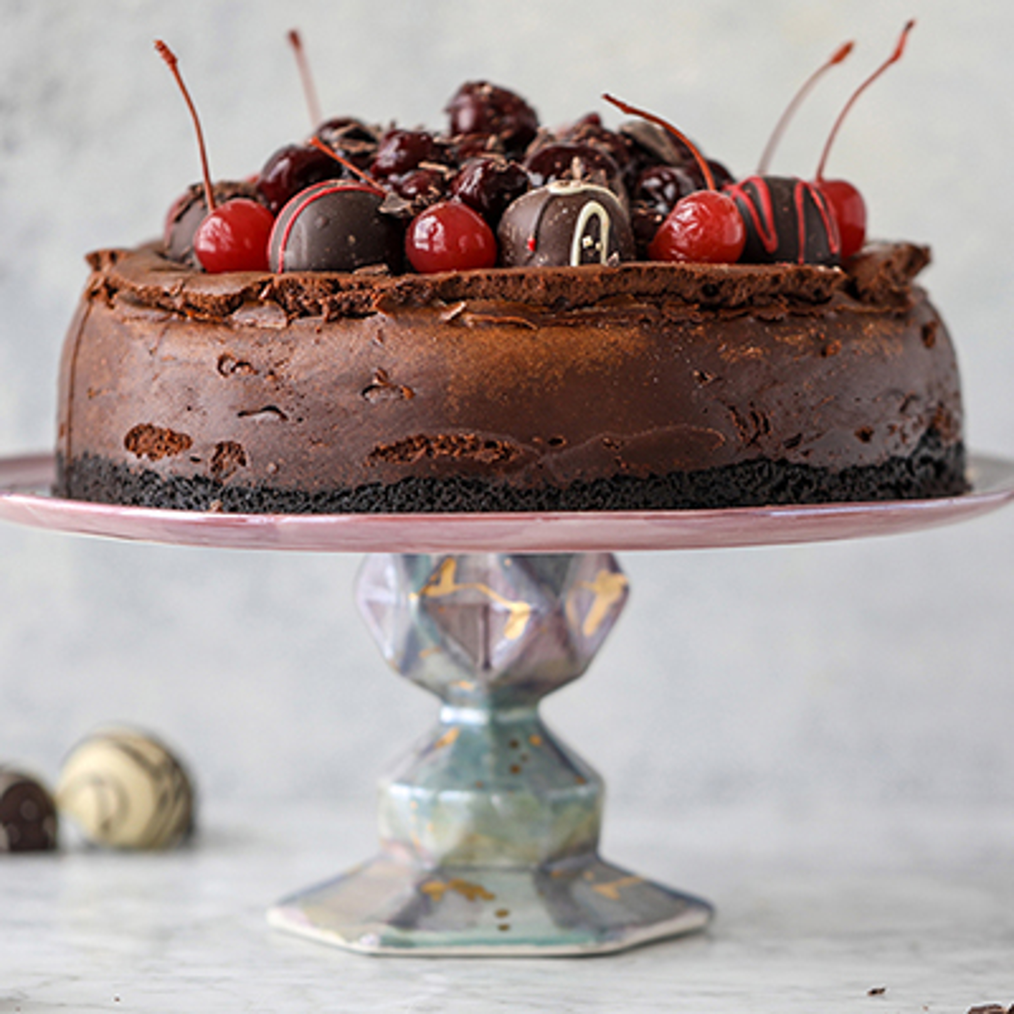 A photo of mother's day brunch ideas with a chocolate cherry cheesecake