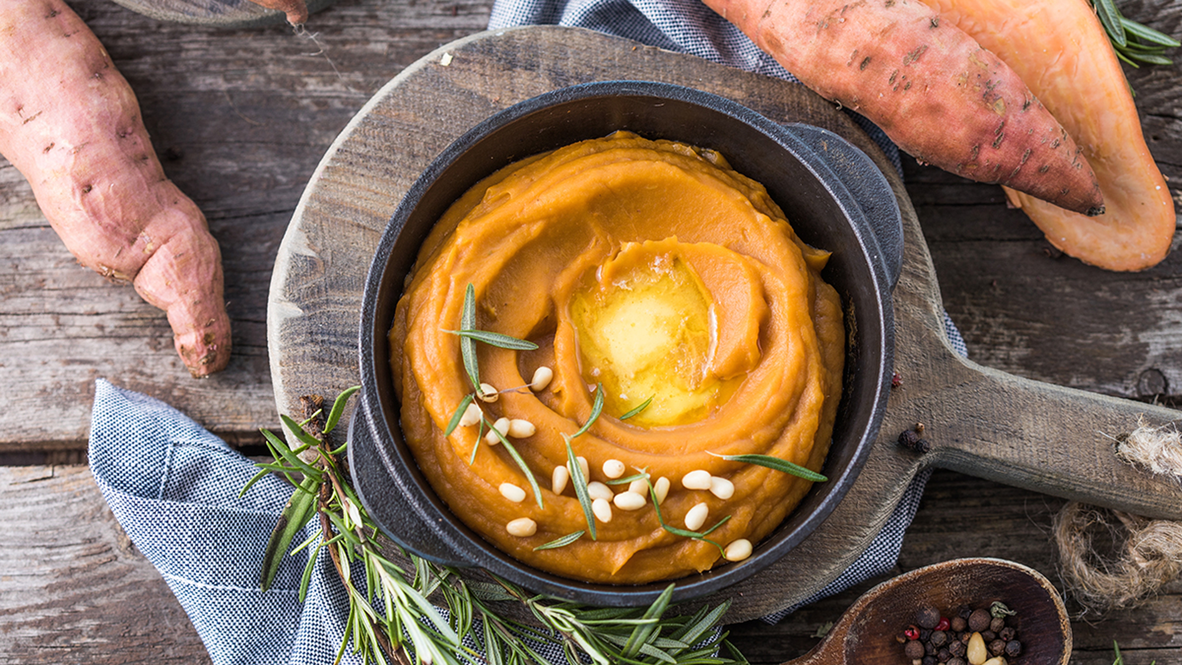 Sweet potato puree in a bowl with garnish.