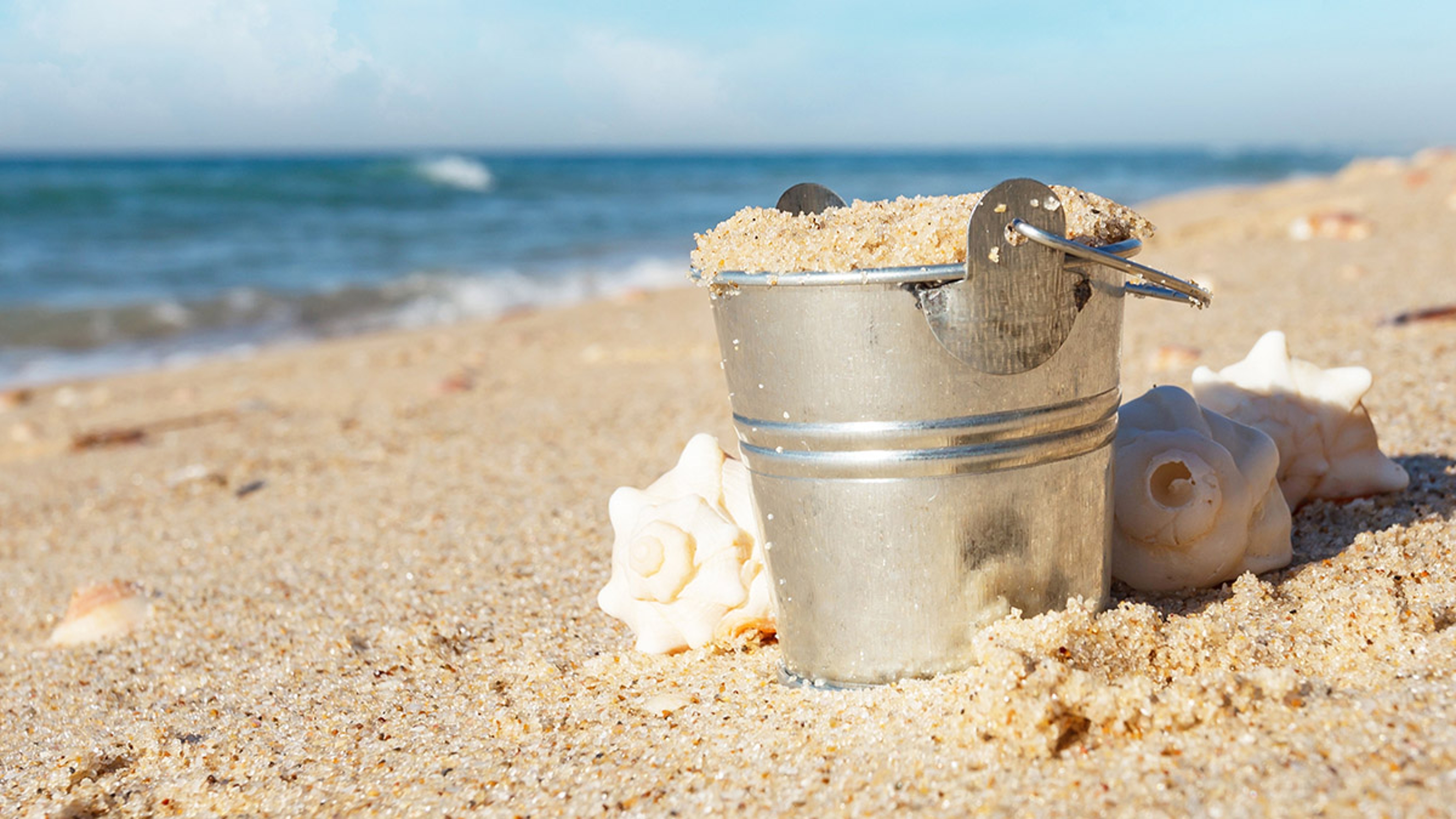 Article Cards Featured Image metal pail at the beach