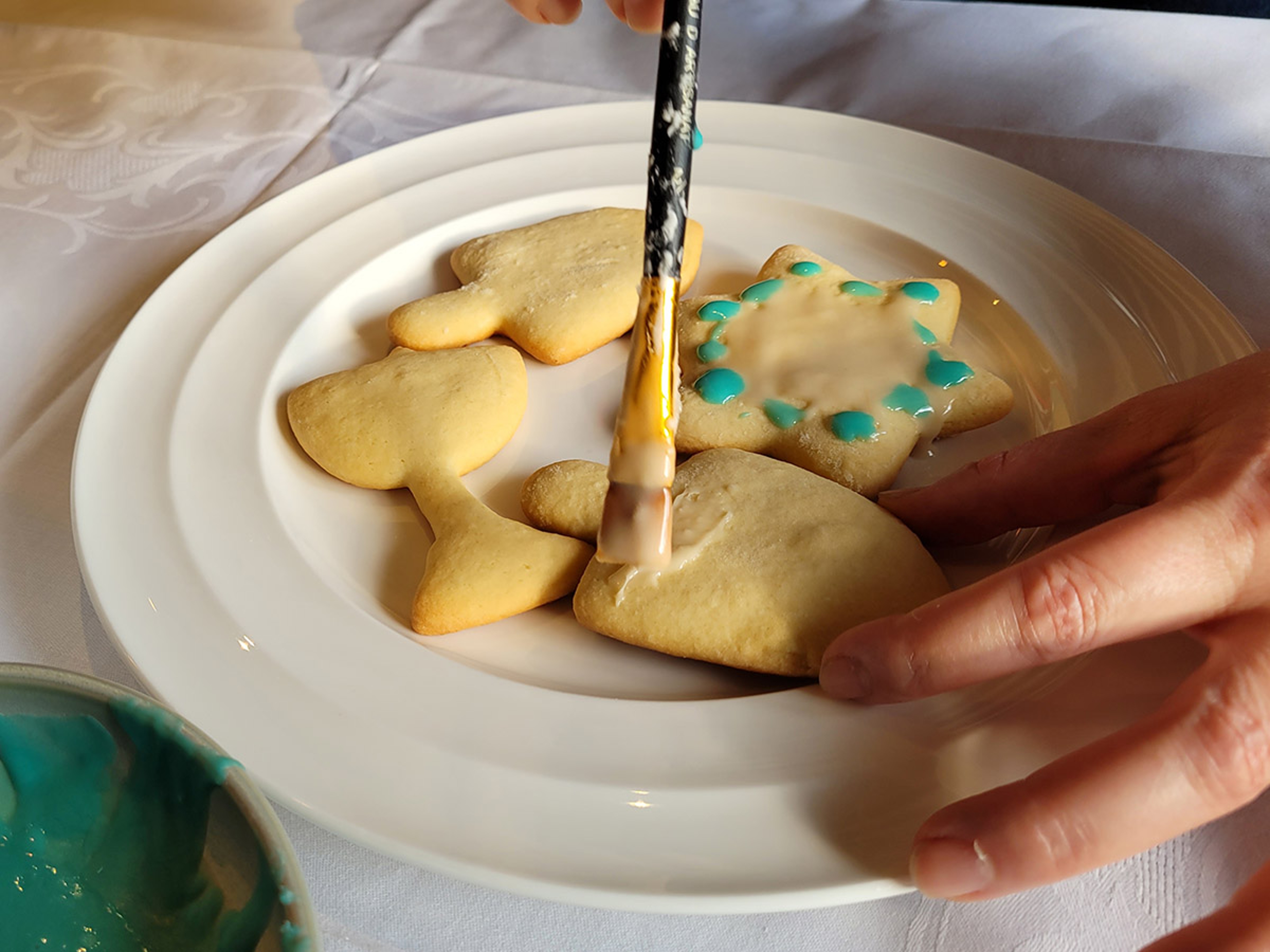 painting icing on a Hanukkah cookie