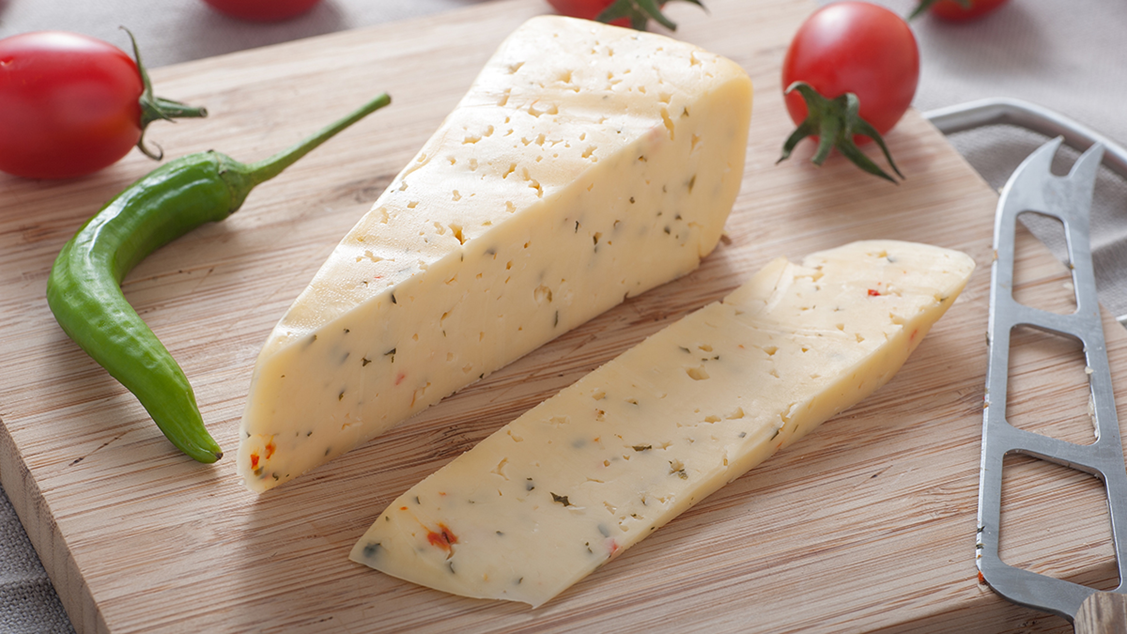 types of cheese a block of spicy hunter cheese on cutting board