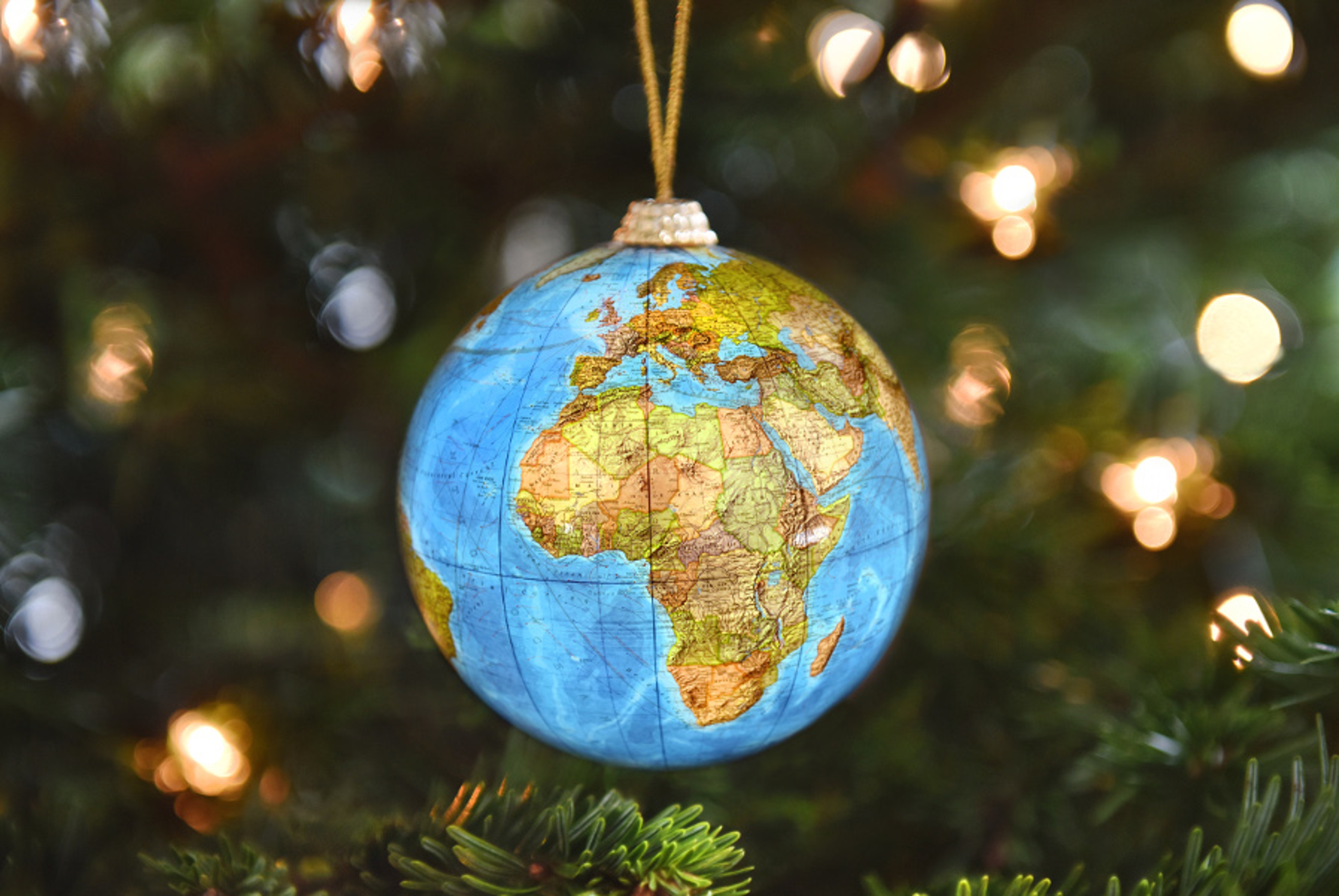 Article Cards Featured Image globe ornament christmas around the world