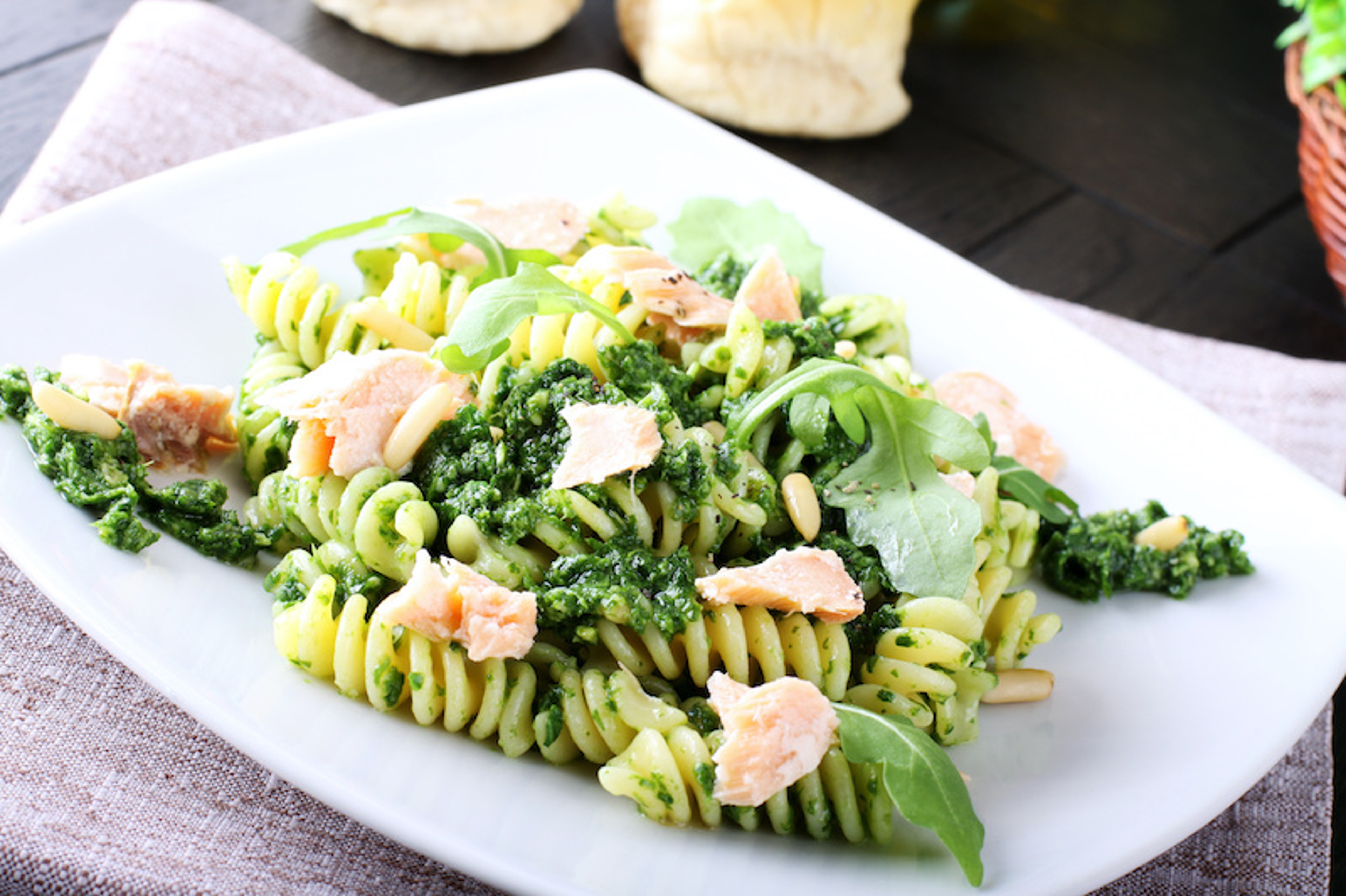 Pasta with arugula pesto and salmon adds visual and taste notes that may please even salmon skeptics.