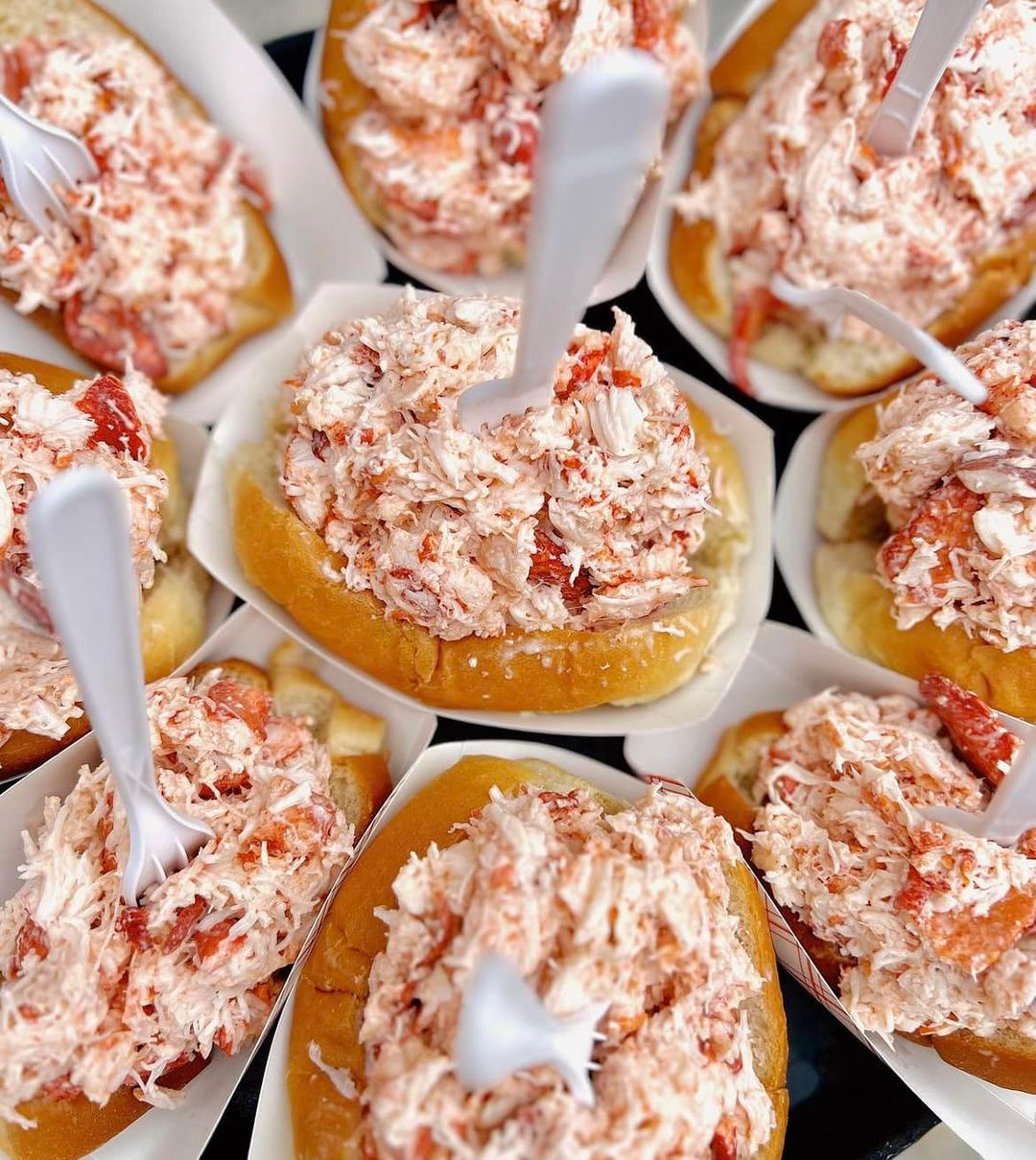 Closeup shot of multiple lobster rolls.