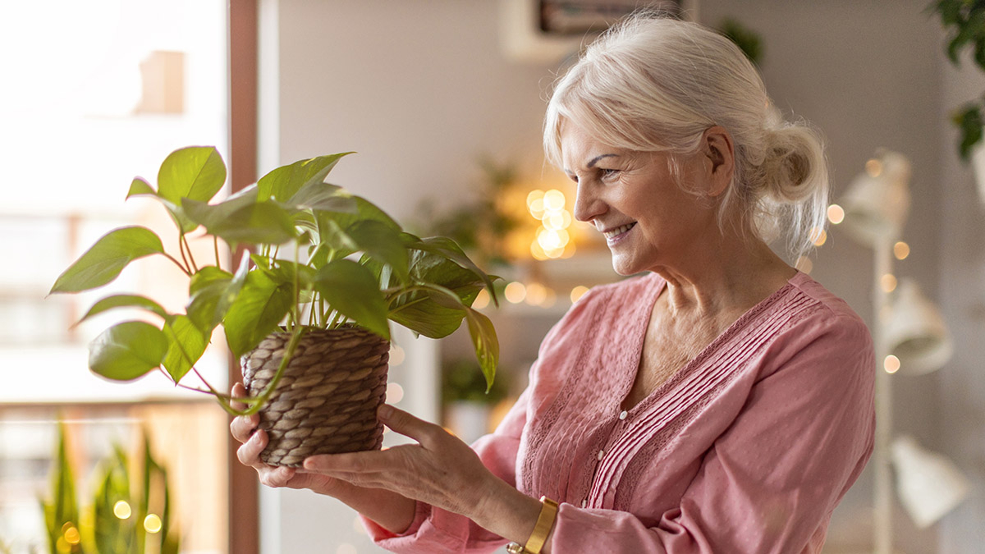 Memory Garden ideas woman holding plant