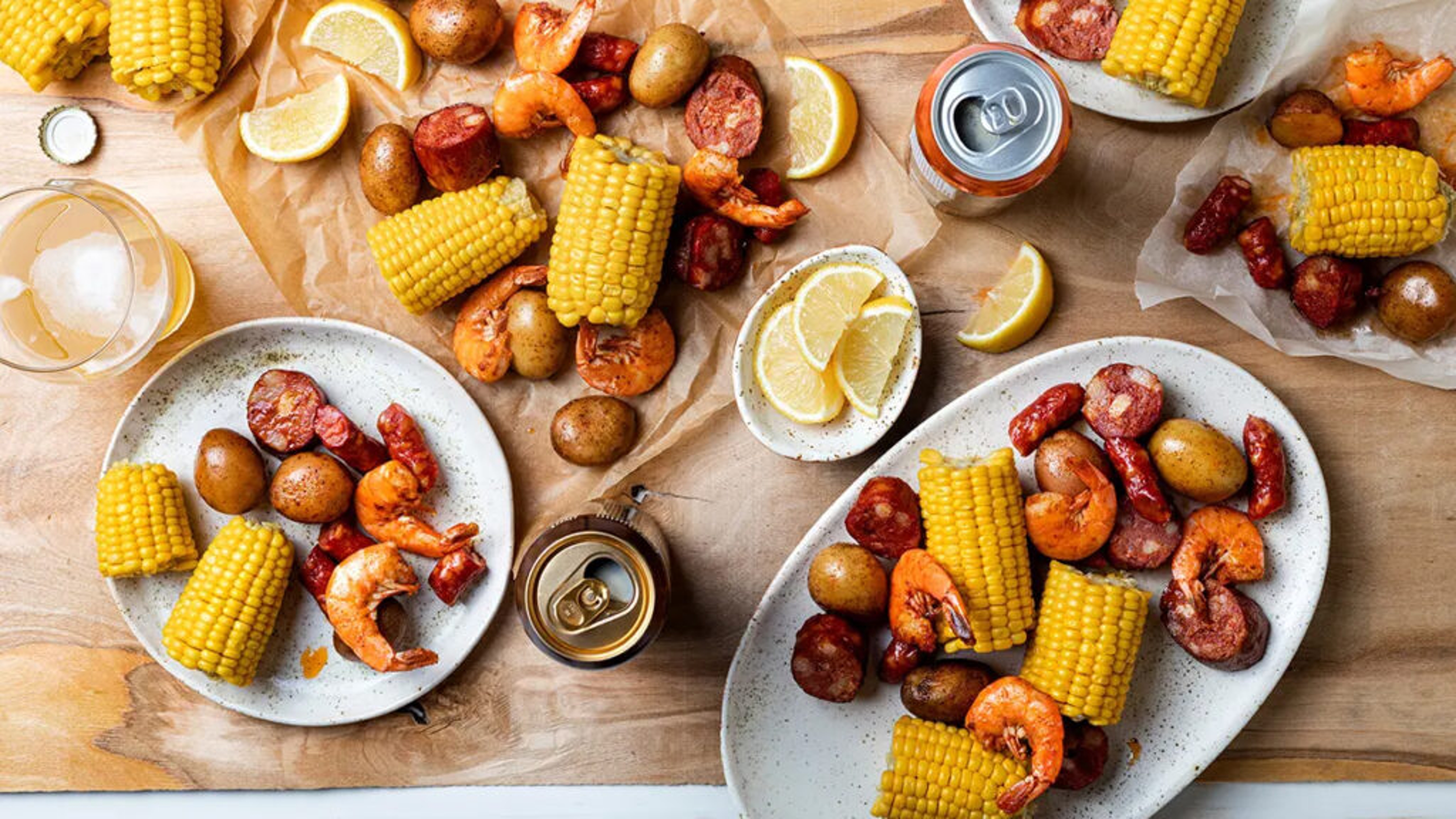 Spring break ideas with a low country boil on a table with beer.