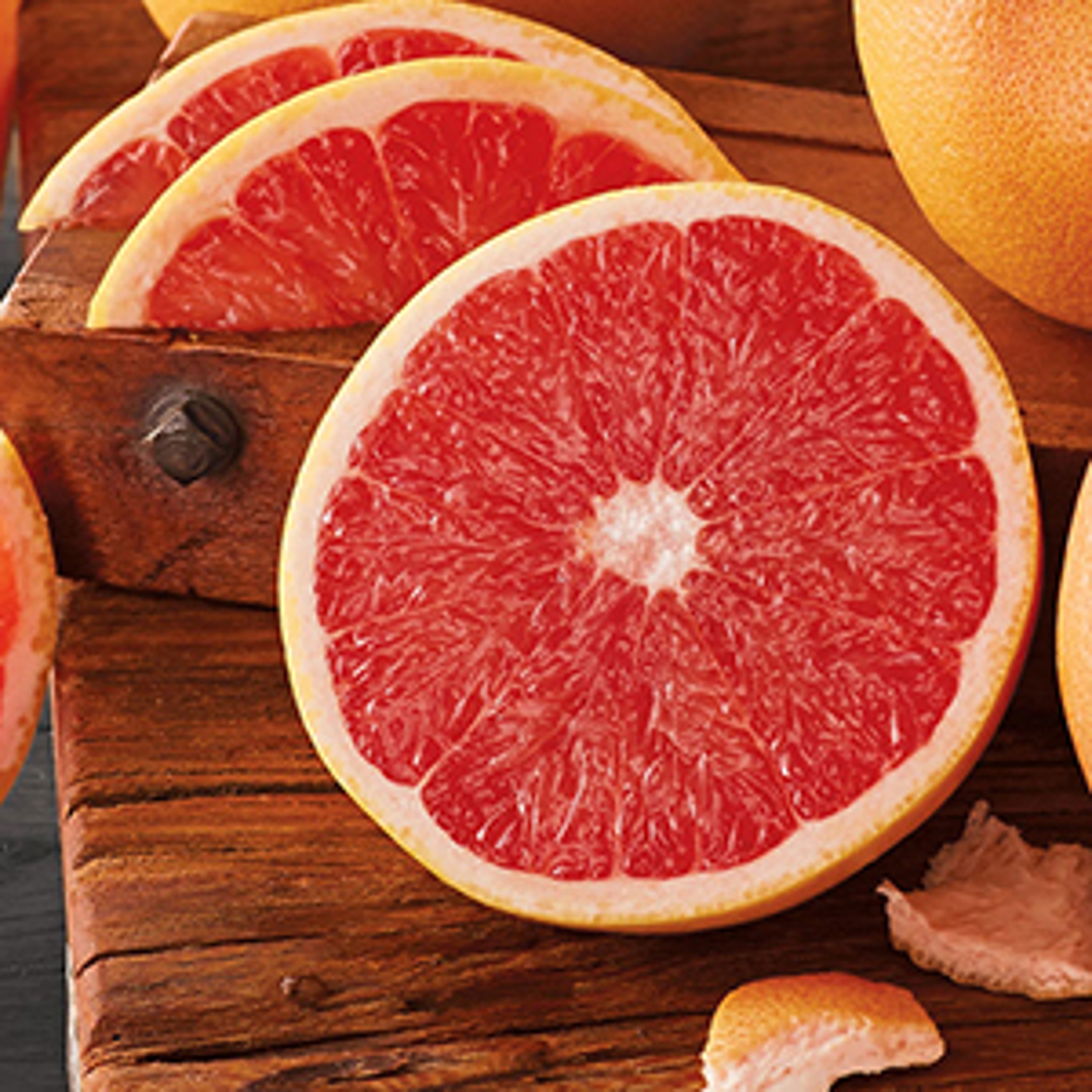 Sliced grapefruit on a cutting board.