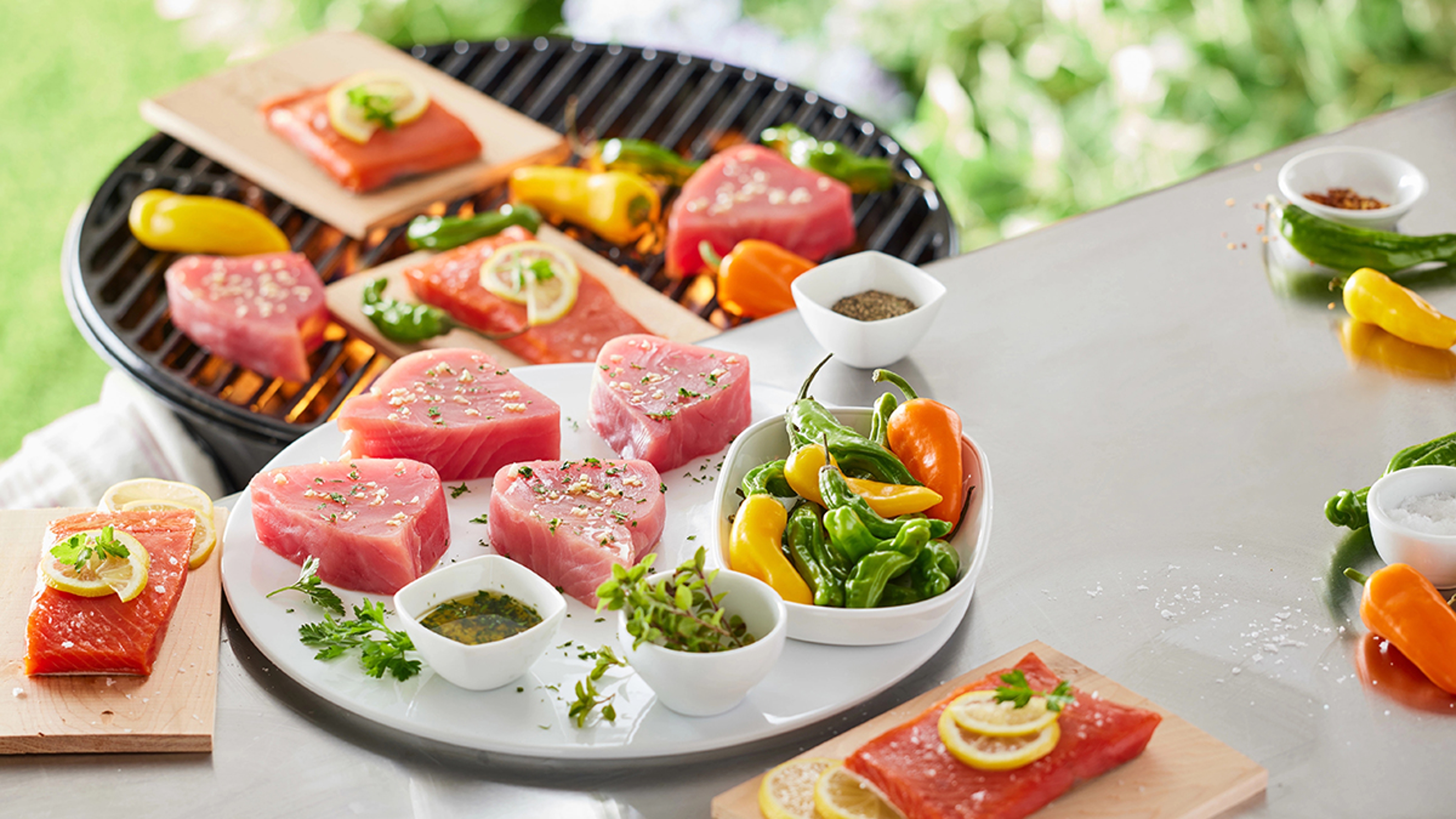 Raw seafood prepped for grilling.