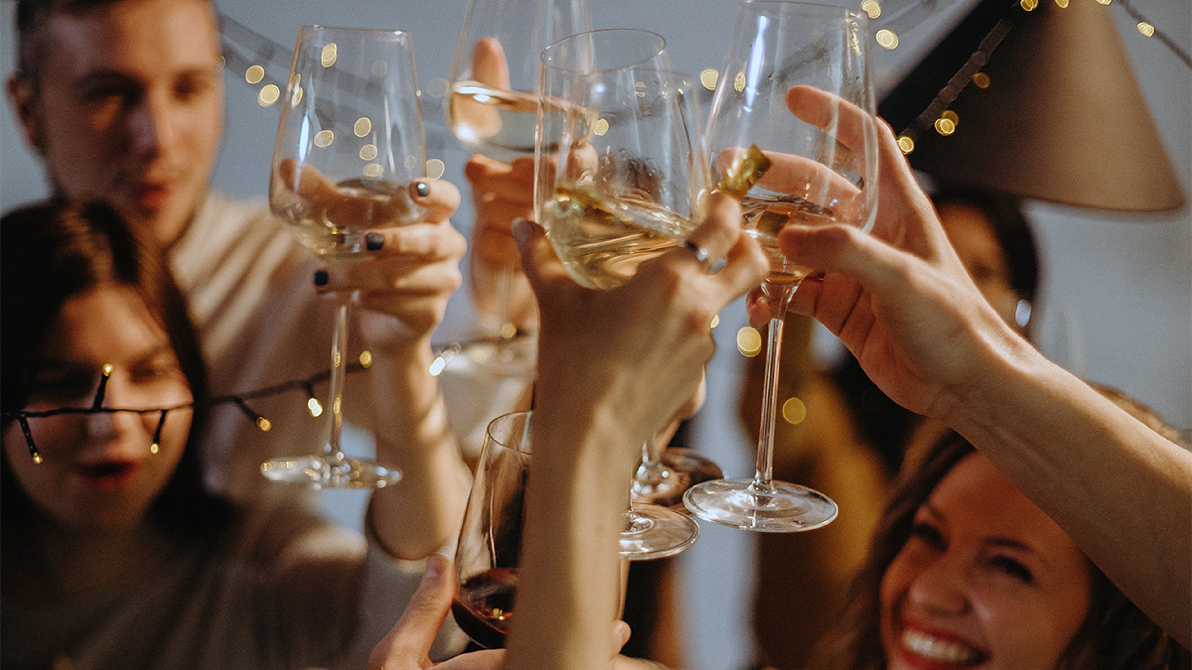 Article Cards Featured Image people toasting at a housewarming party