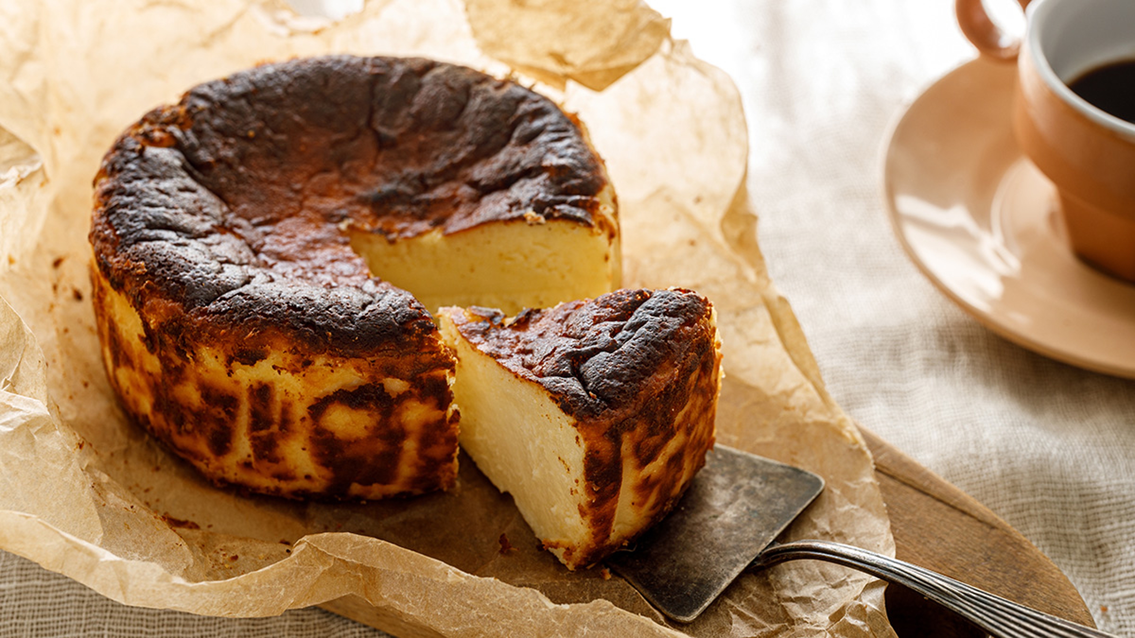 Basque cheesecake wrapped in parchment paper.