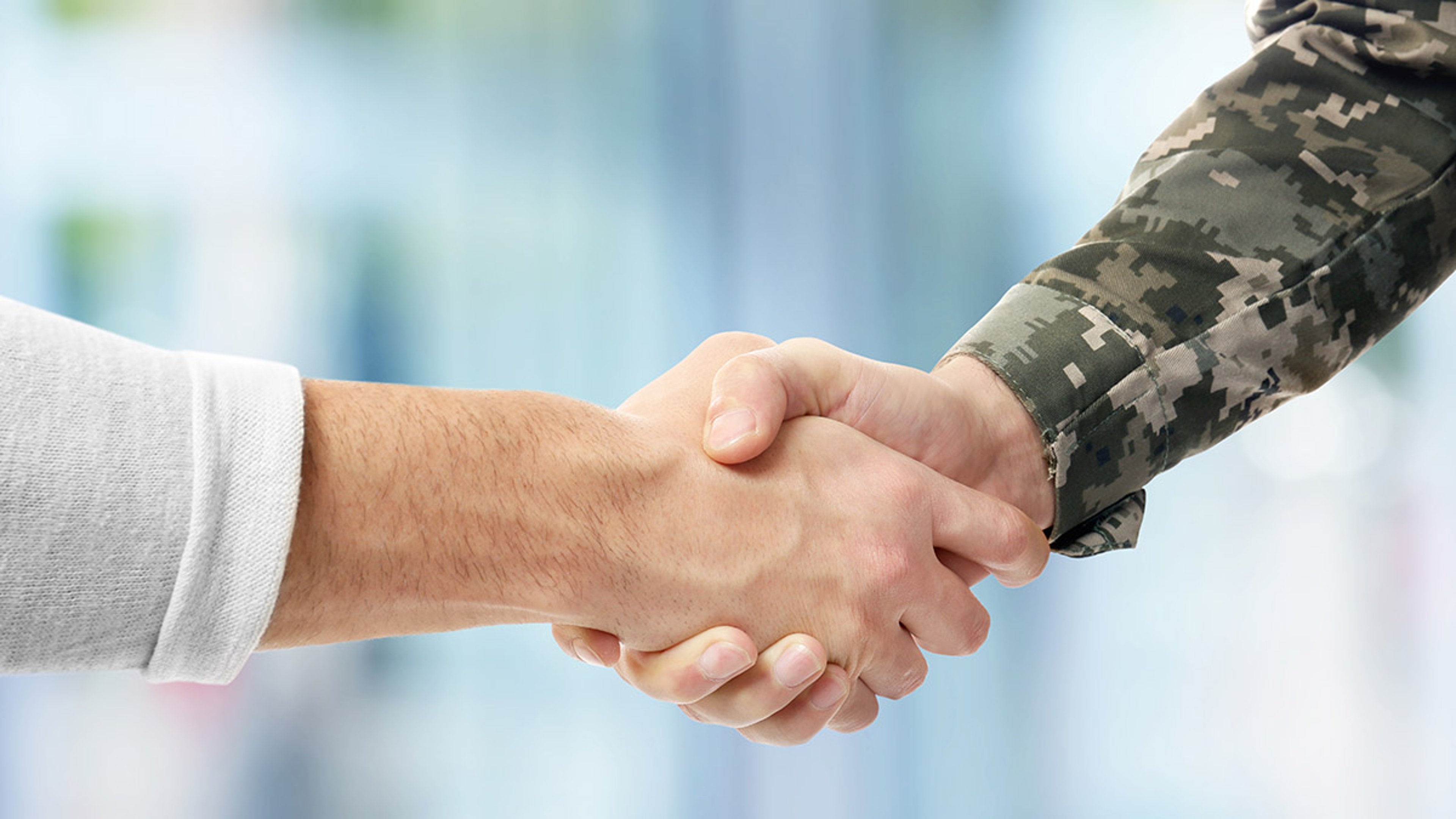 Article Cards Featured Image honoring veterans with shaking hands with veteran