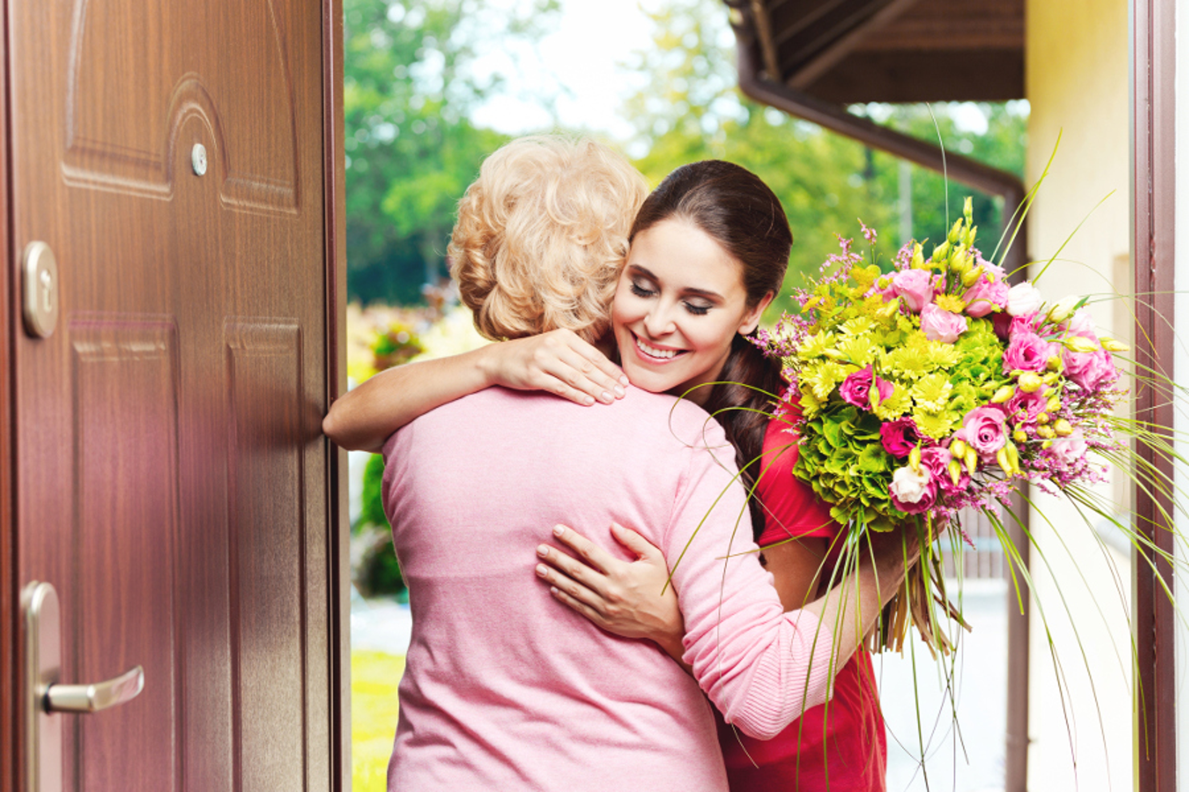 Article Cards Featured Image woman giving grandmother flowers