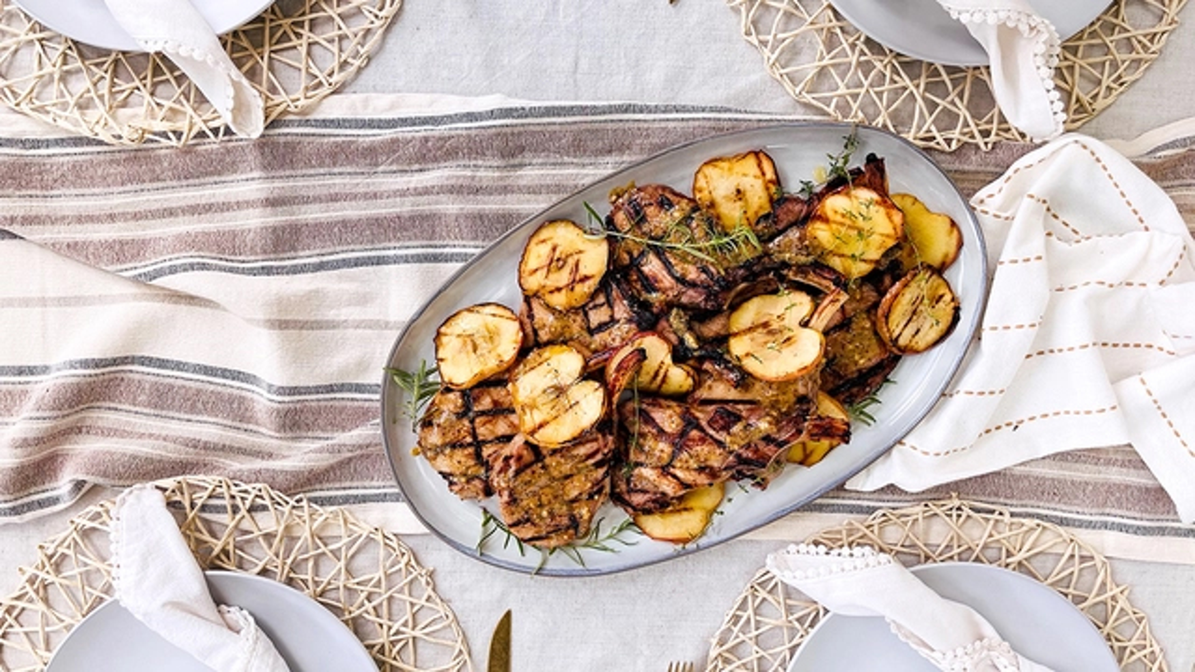 Plate of pork chops with apples.