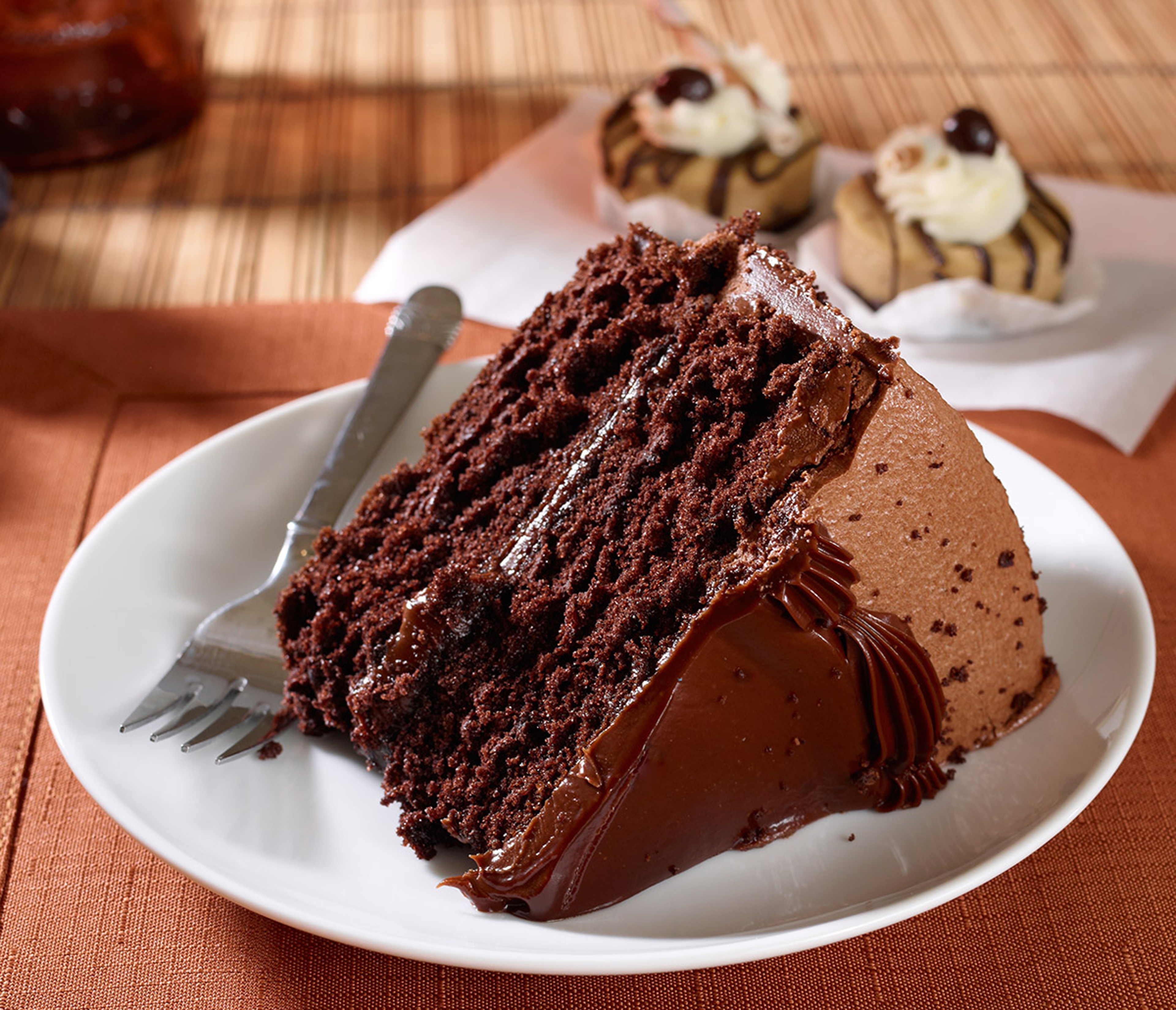 A slice of rich moist devil's food chocolate cake photographed with a mp Phase One camera