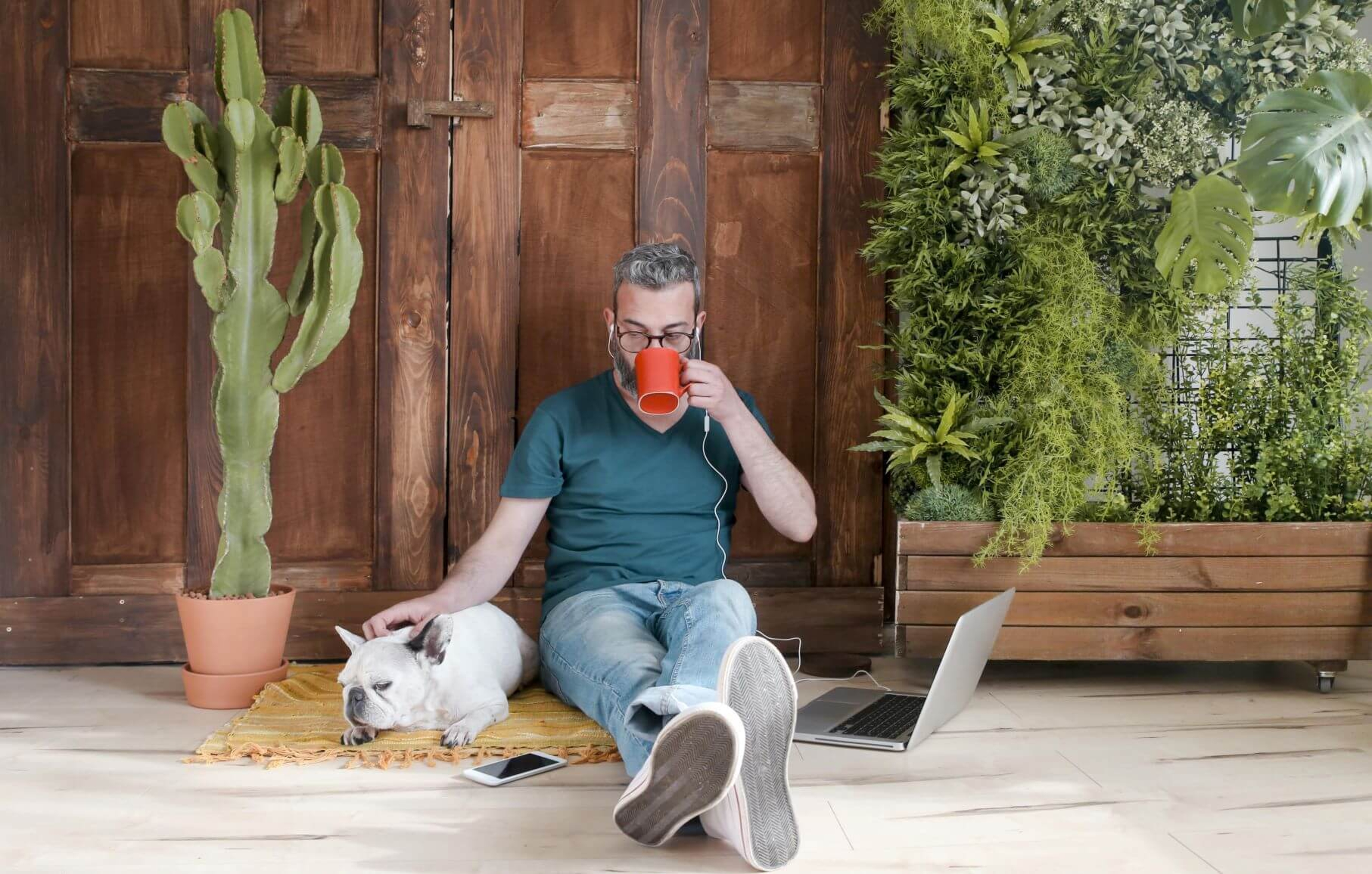 Article Cards Featured Image Man sitting with dog and plants