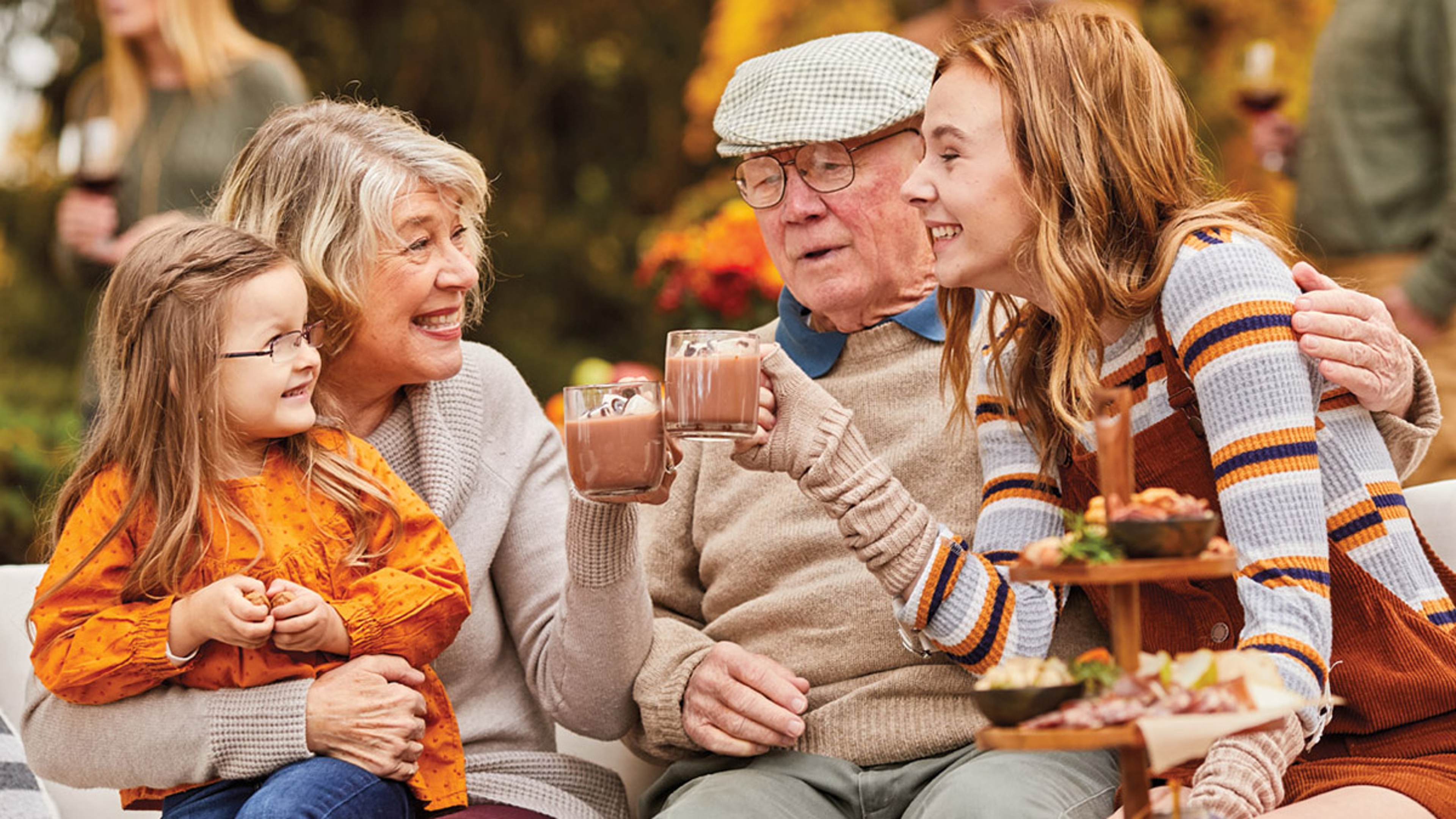 Grandparents day image grandparents and grandchildren drinking hot chocolate outside