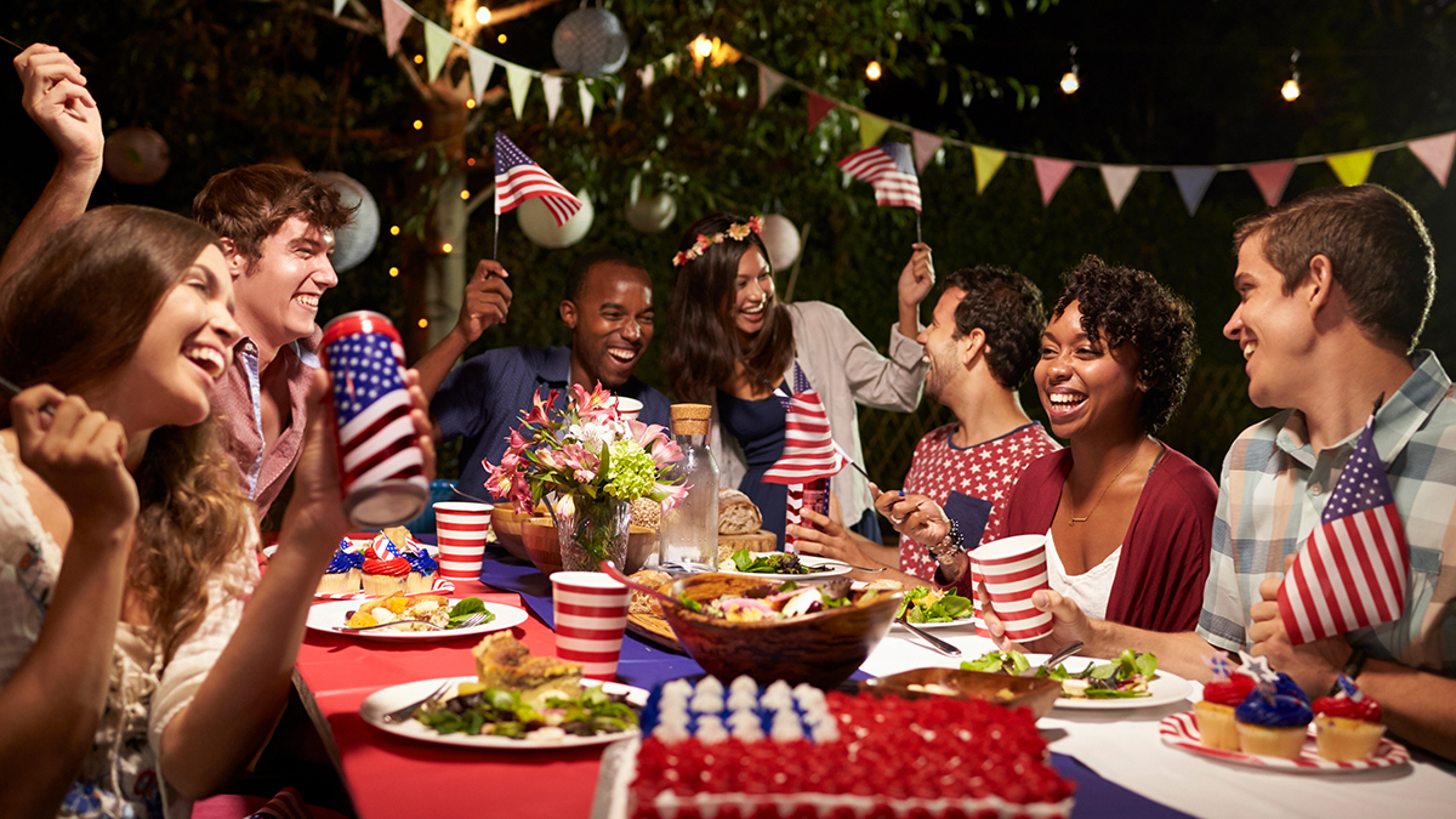 Friends Celebrating th Of July Holiday With Backyard Party