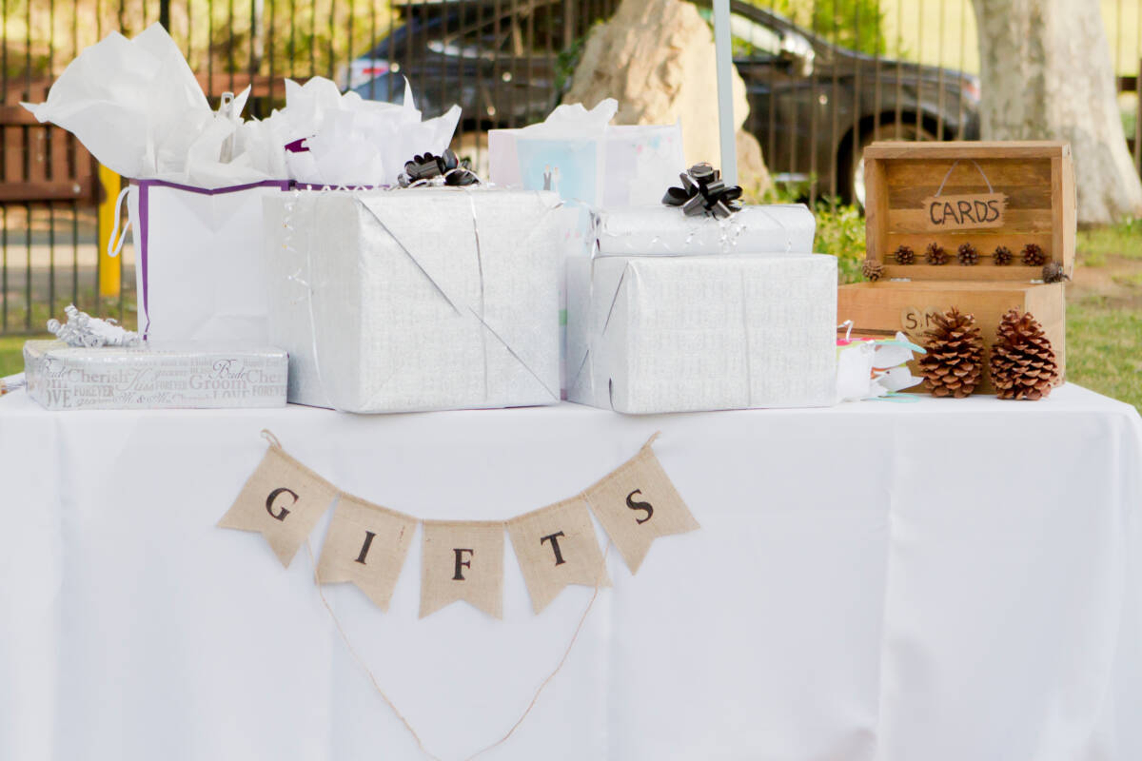 Several gifts wrapped and on a table.