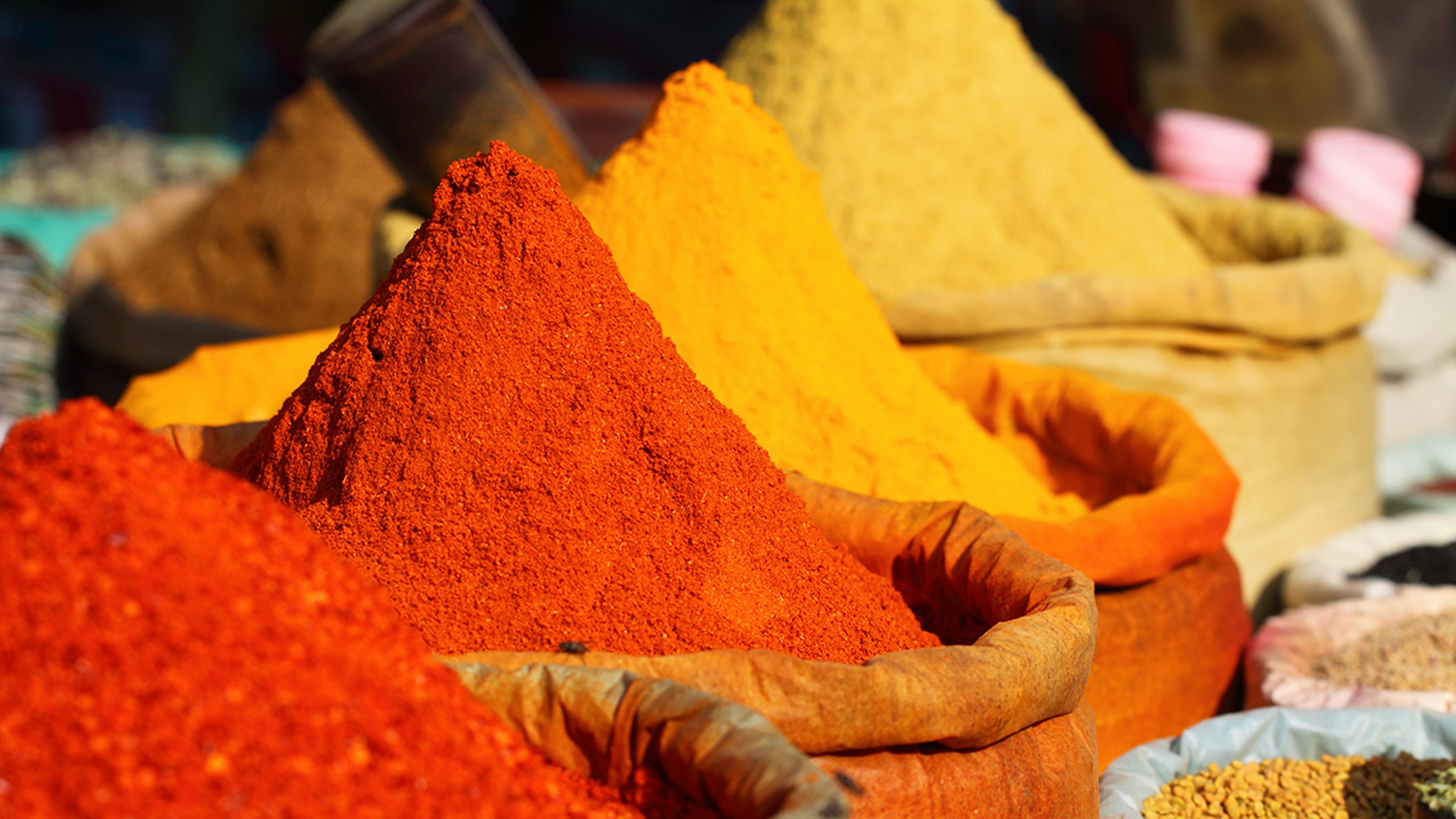 Stacks of spices at a market.