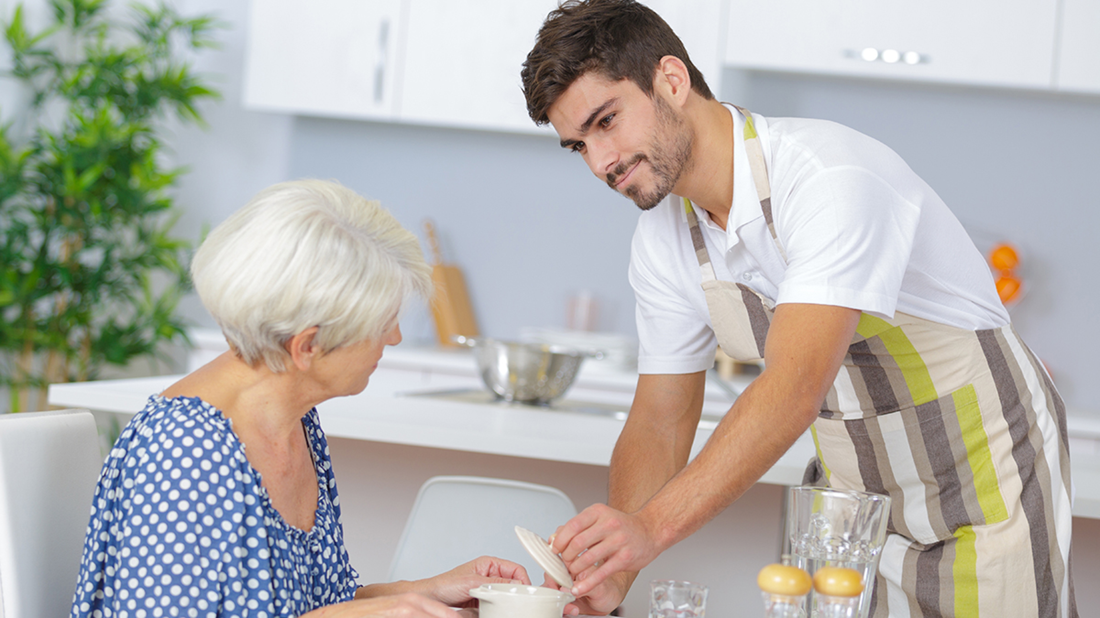 Article Cards Featured Image carer serving lunch to senior woman