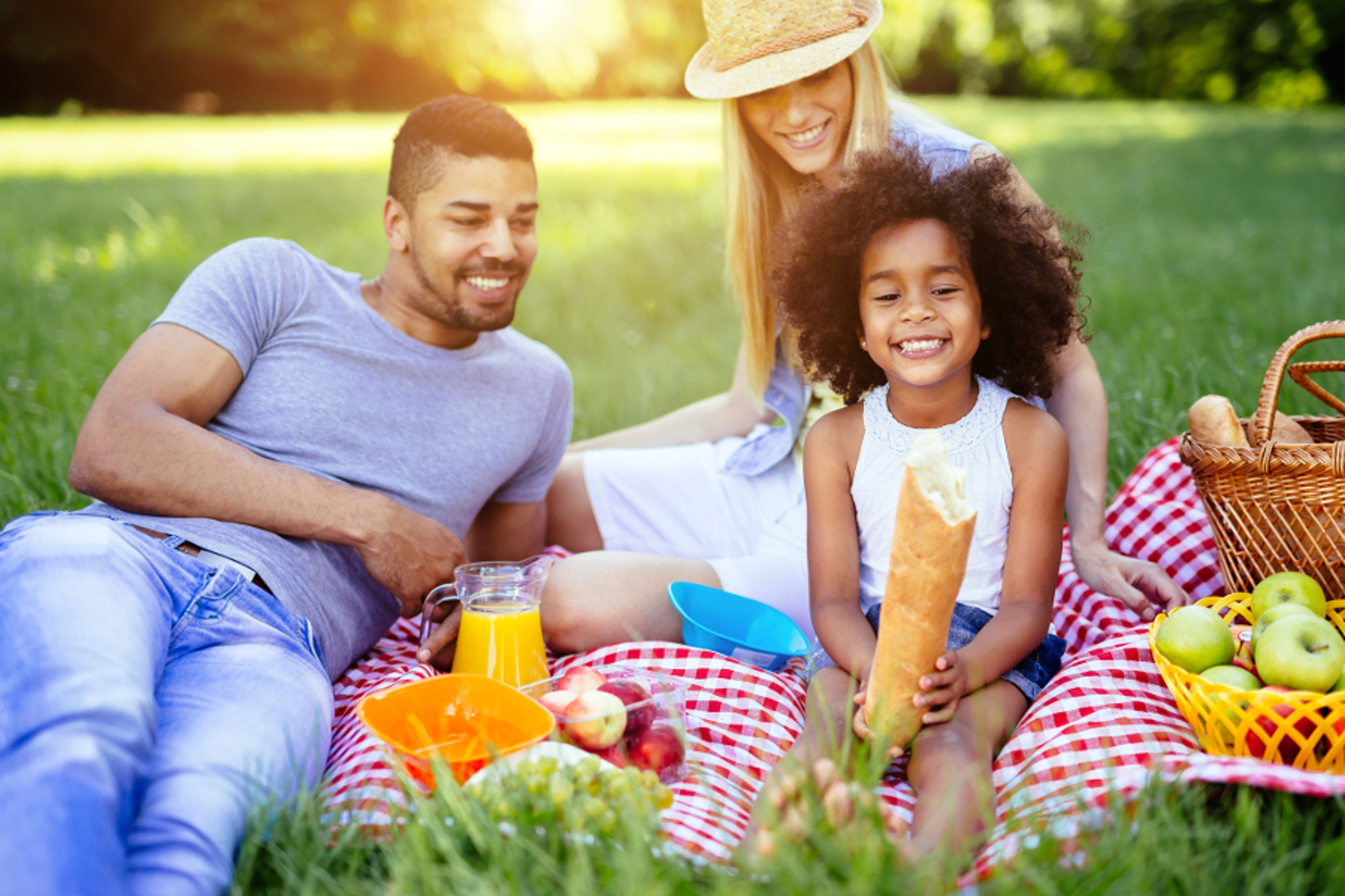 Article Cards Featured Image Family picnicking outdoors with their cute daughter